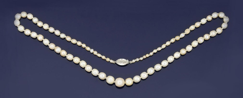 A pearl and diamond necklace