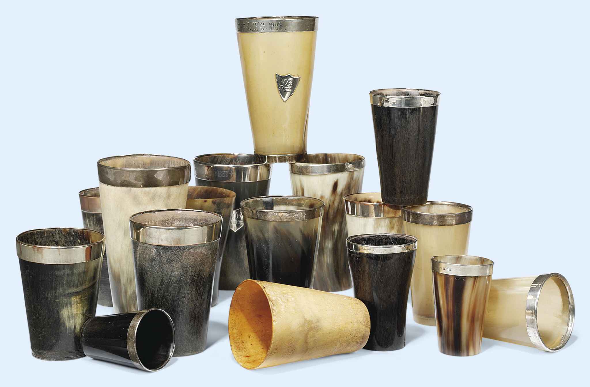 A GROUP OF NINE V SILVERMOUNTED HORN BEAKERS