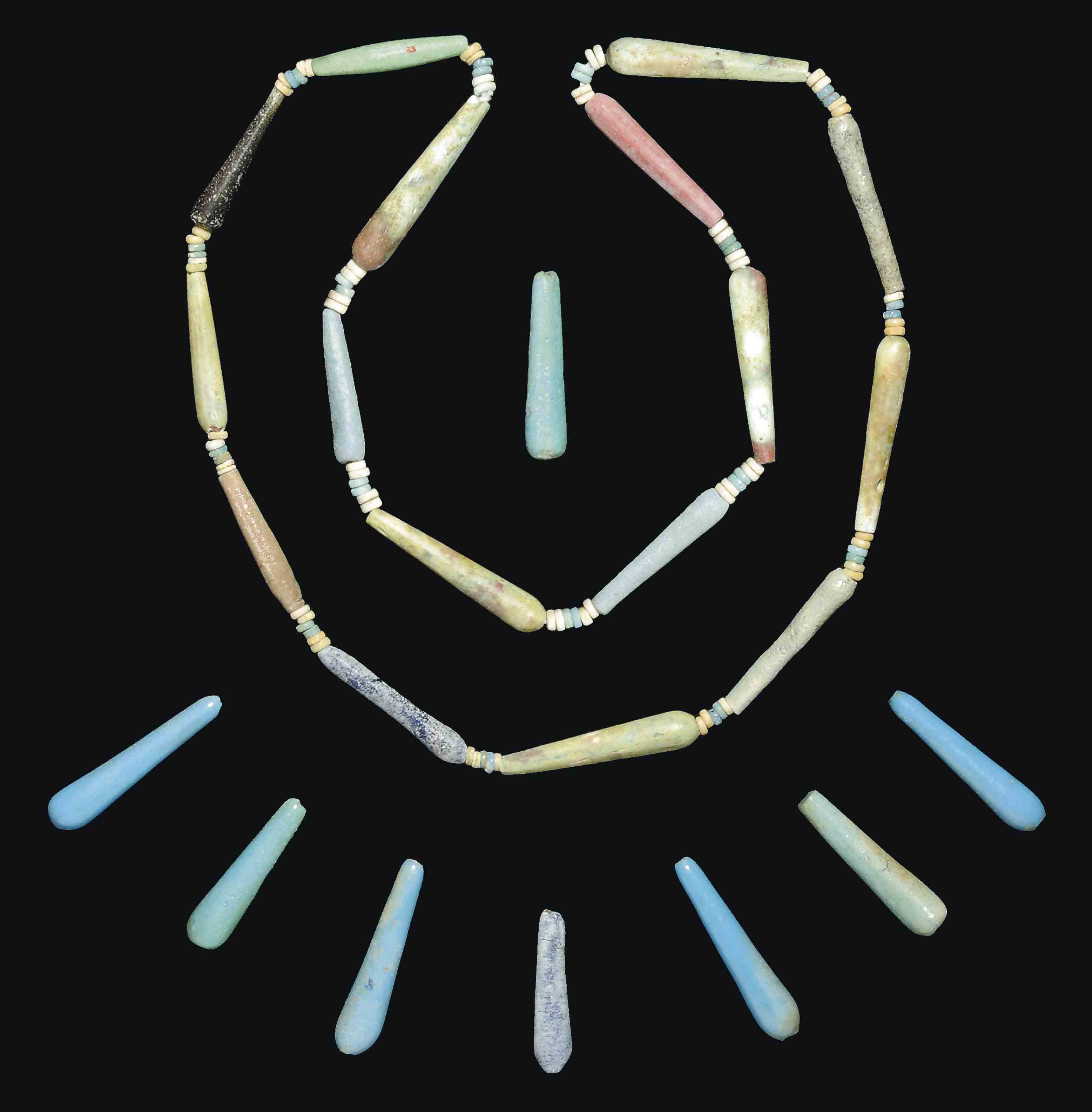 AN EGYPTIAN GLASS BEAD NECKLACE AND EIGHT GLASS DROP BEADS , NEW KINGDOM, DYNASTY XVIII, AMARNA
