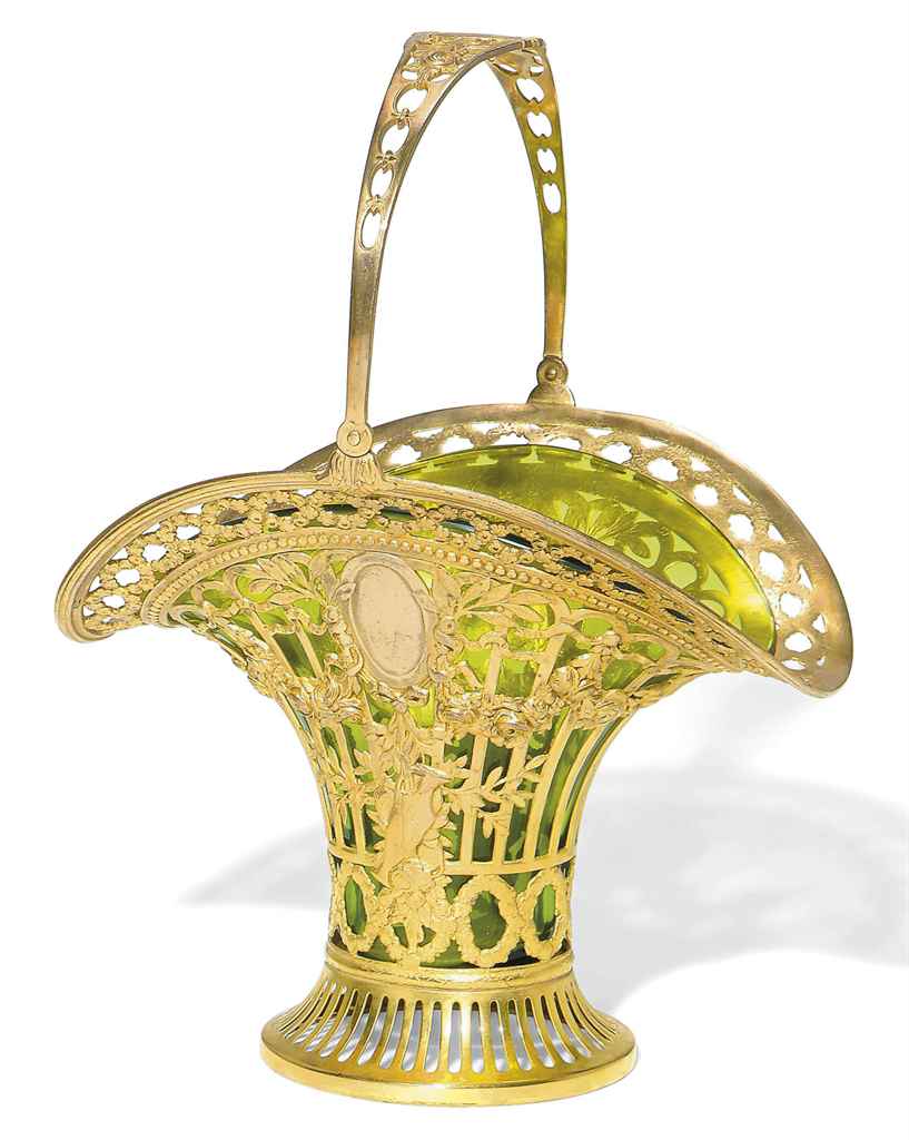 A CONTINENTAL GILTMETAL AND GREENGLASS BASKETSHAPED VASE , EARLY