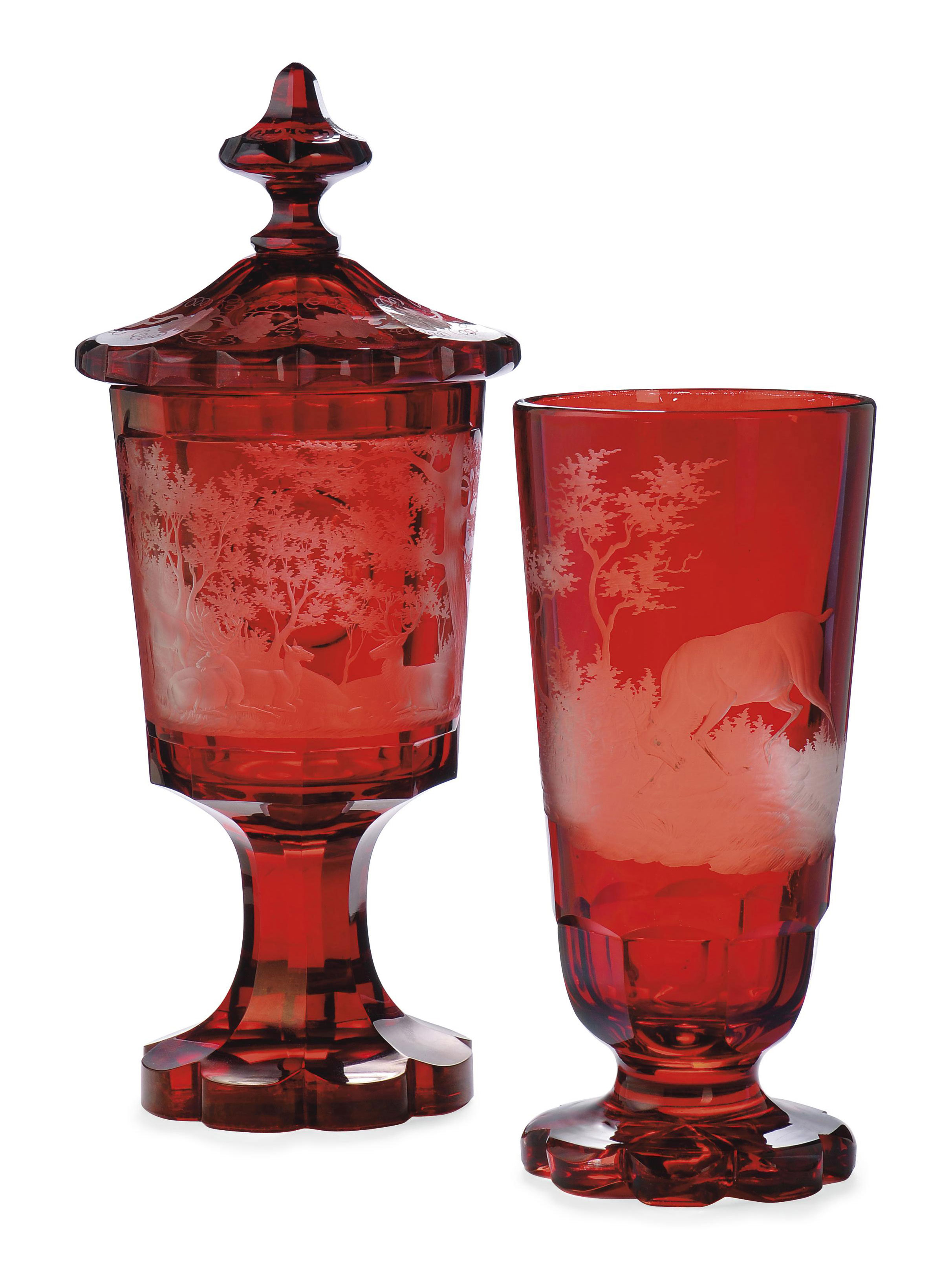 A BOHEMIAN RUBYSTAINED GLASS JAR AND COVER AND A VASE , THIRD QUARTER