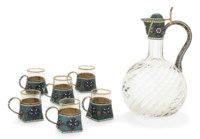 A RUSSIAN SILVER-GILT AND CLOISONNE ENAMEL VODKA JUG WITH 6 VODKA CUPS EN SUITE
