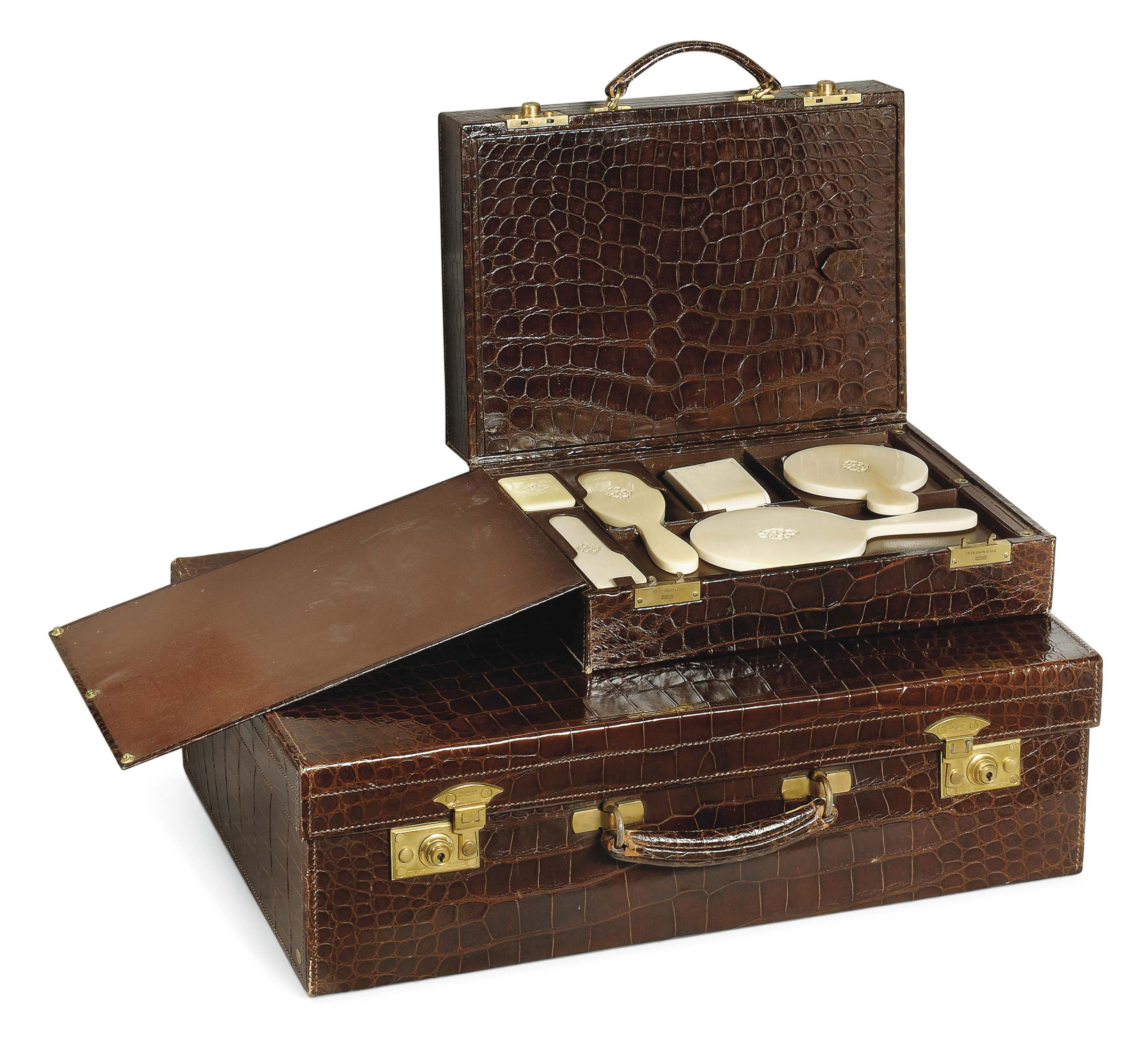 A DRESSING CASE AND MATCHING SUITCASE , ENGLISH, CIRCA 193639 Christie's