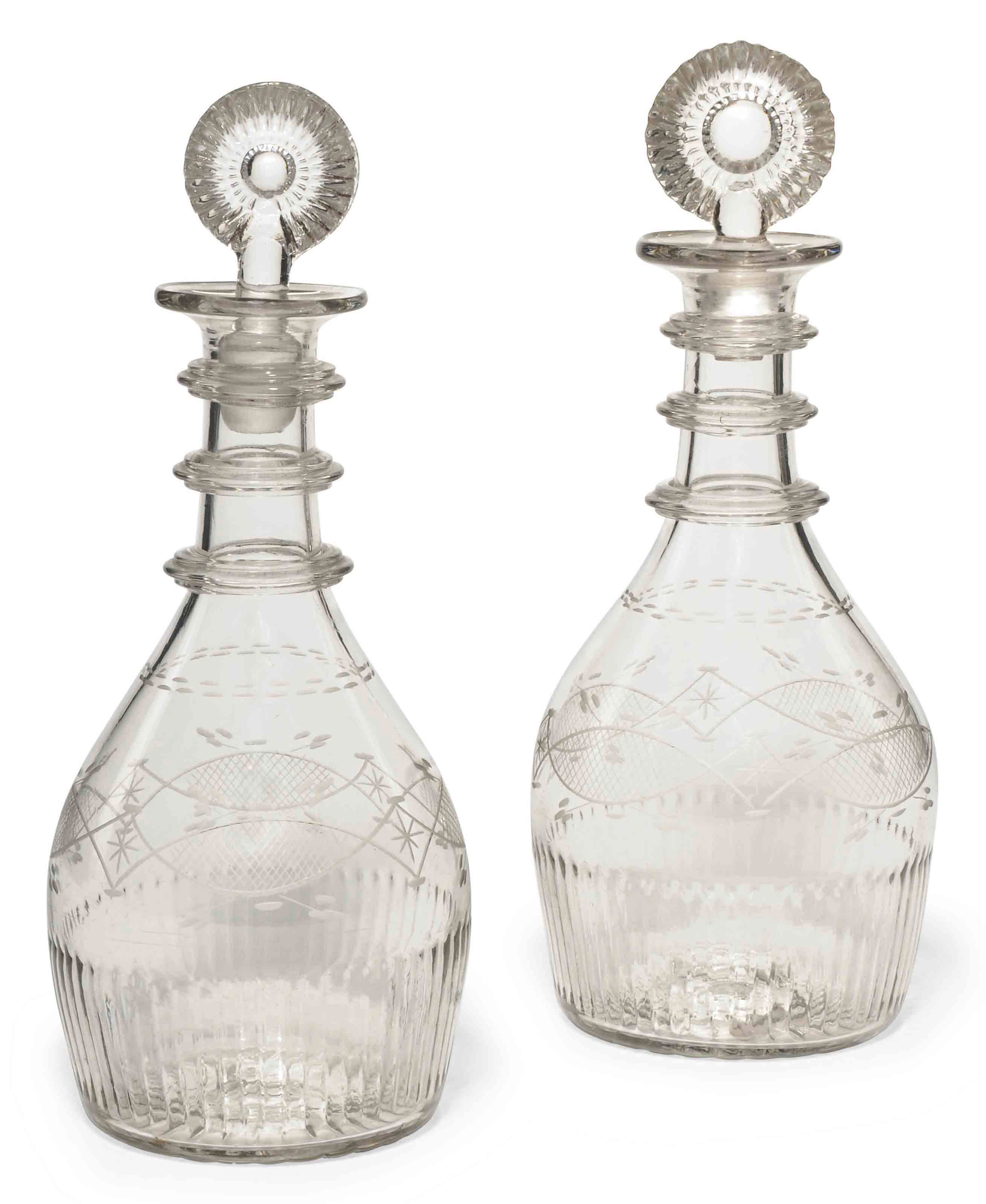 A PAIR OF IRISH (WATERLOO GLASS CO.) DECANTERS AND STOPPERS , CIRCA