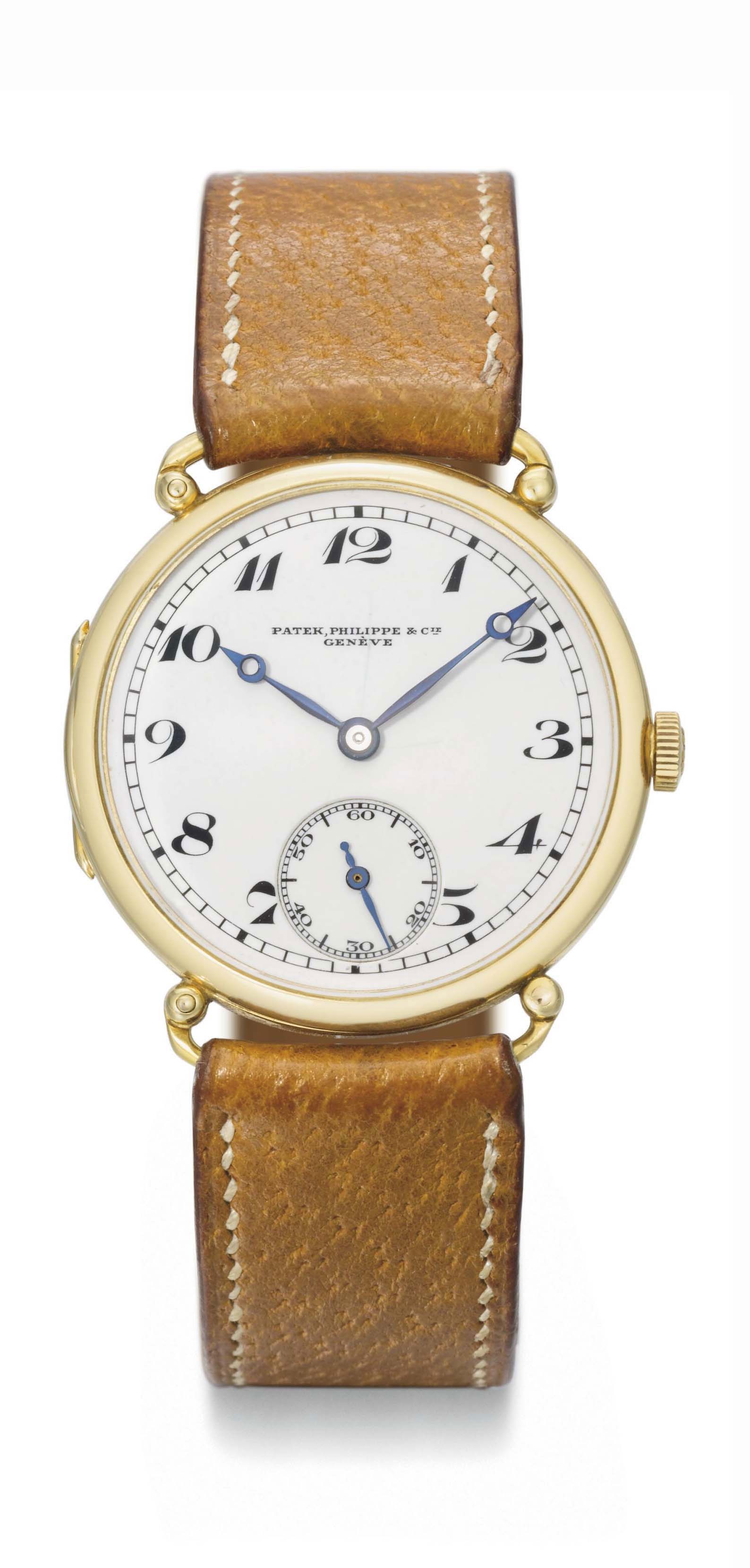 Patek Philippe. A fine and early 18K gold hinged wristwatch with enamel