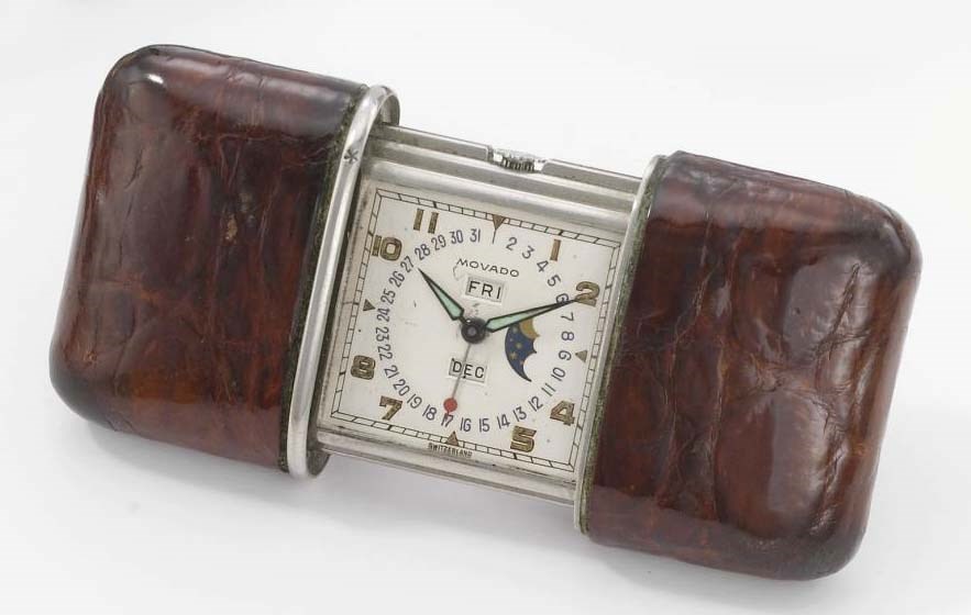 Movado. A stainless steel and leather triple calendar travelling purse watch with moon phases
