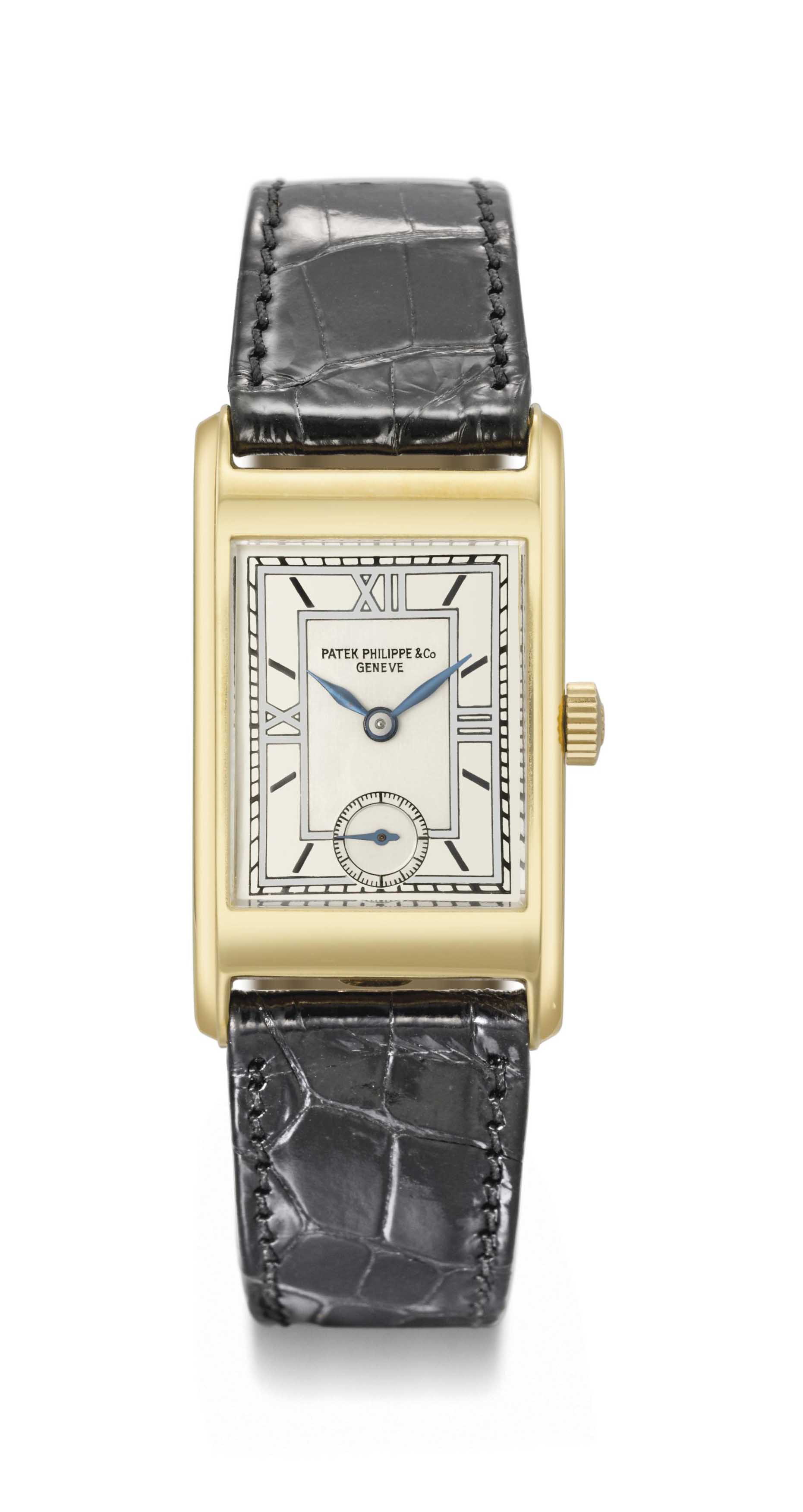 Patek Philippe. An attractive 18K gold rectangular curved wristwatch ...