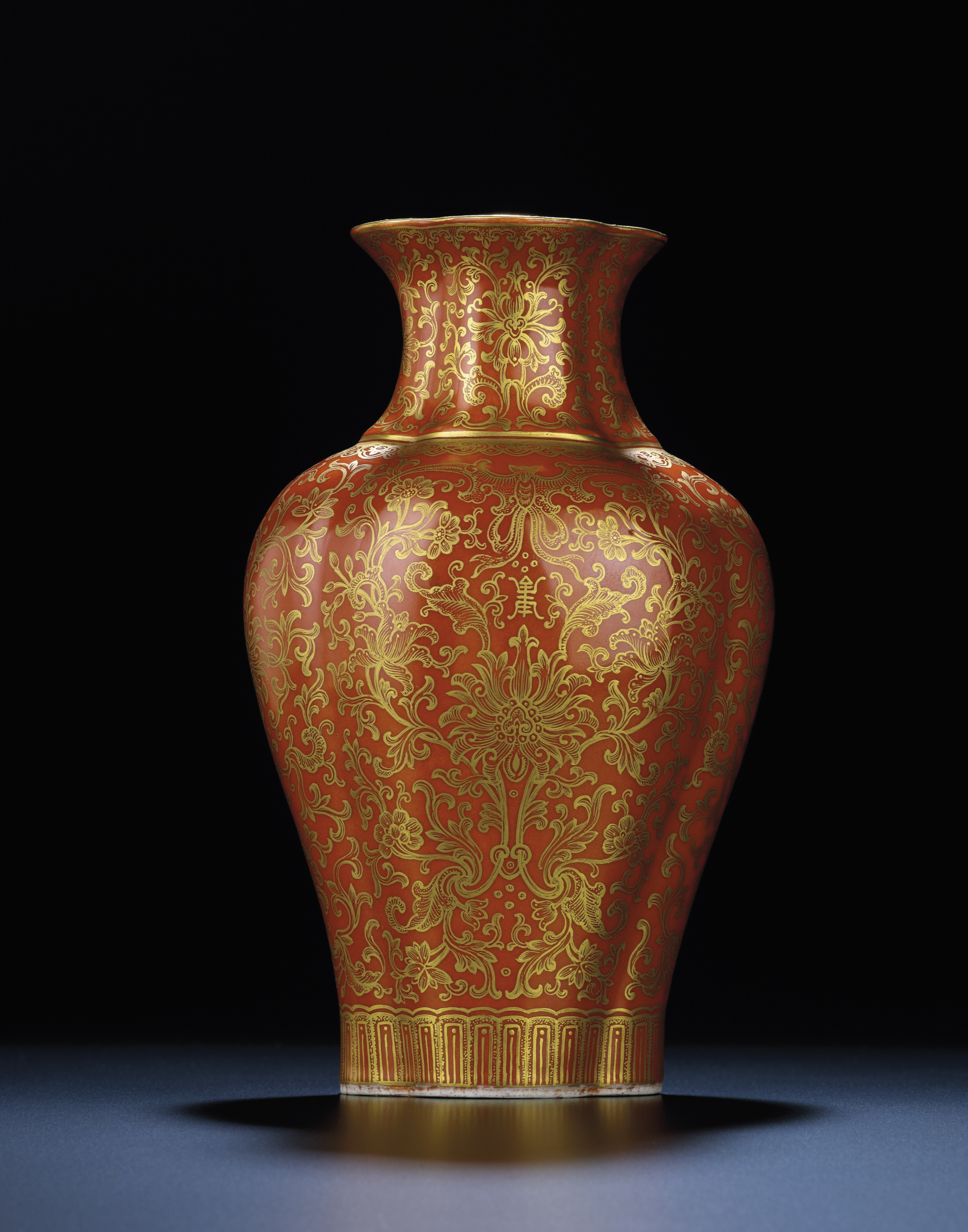 A CORALGROUND GILTDECORATED QUATREFOIL VASE , JIAQING IRONRED SIX