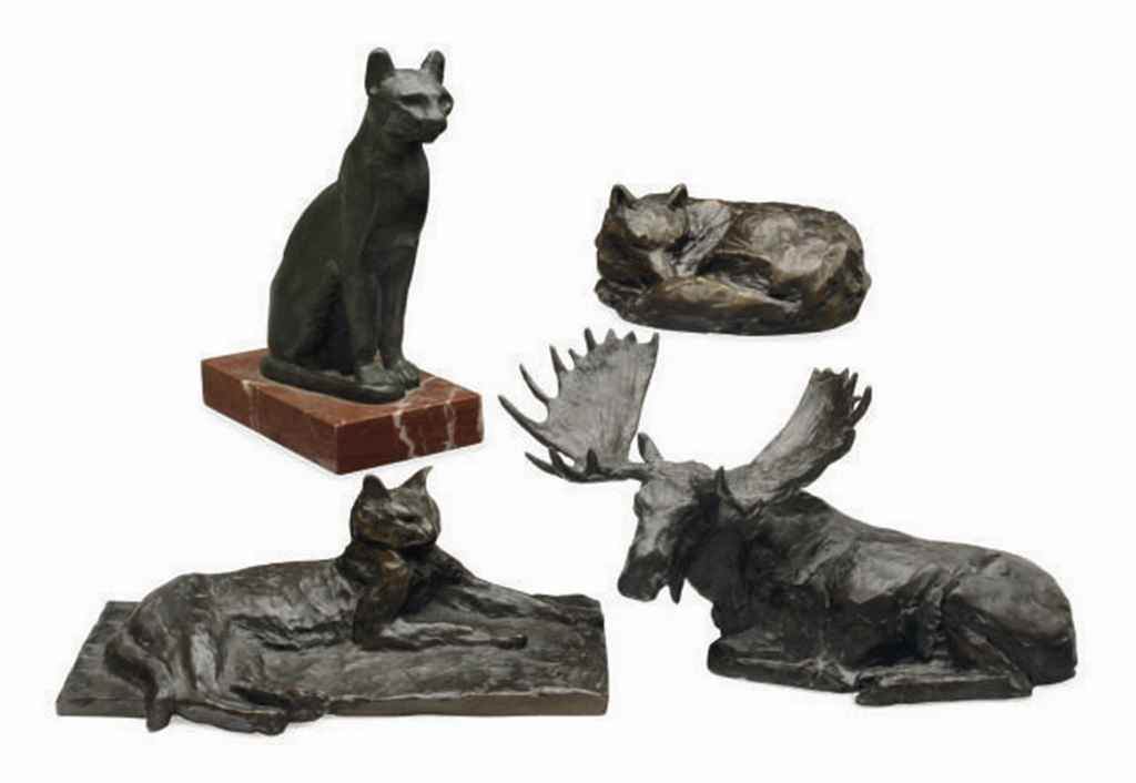 A FRENCH PATINATED BRONZE FIGURE OF A RECLINING CAT,