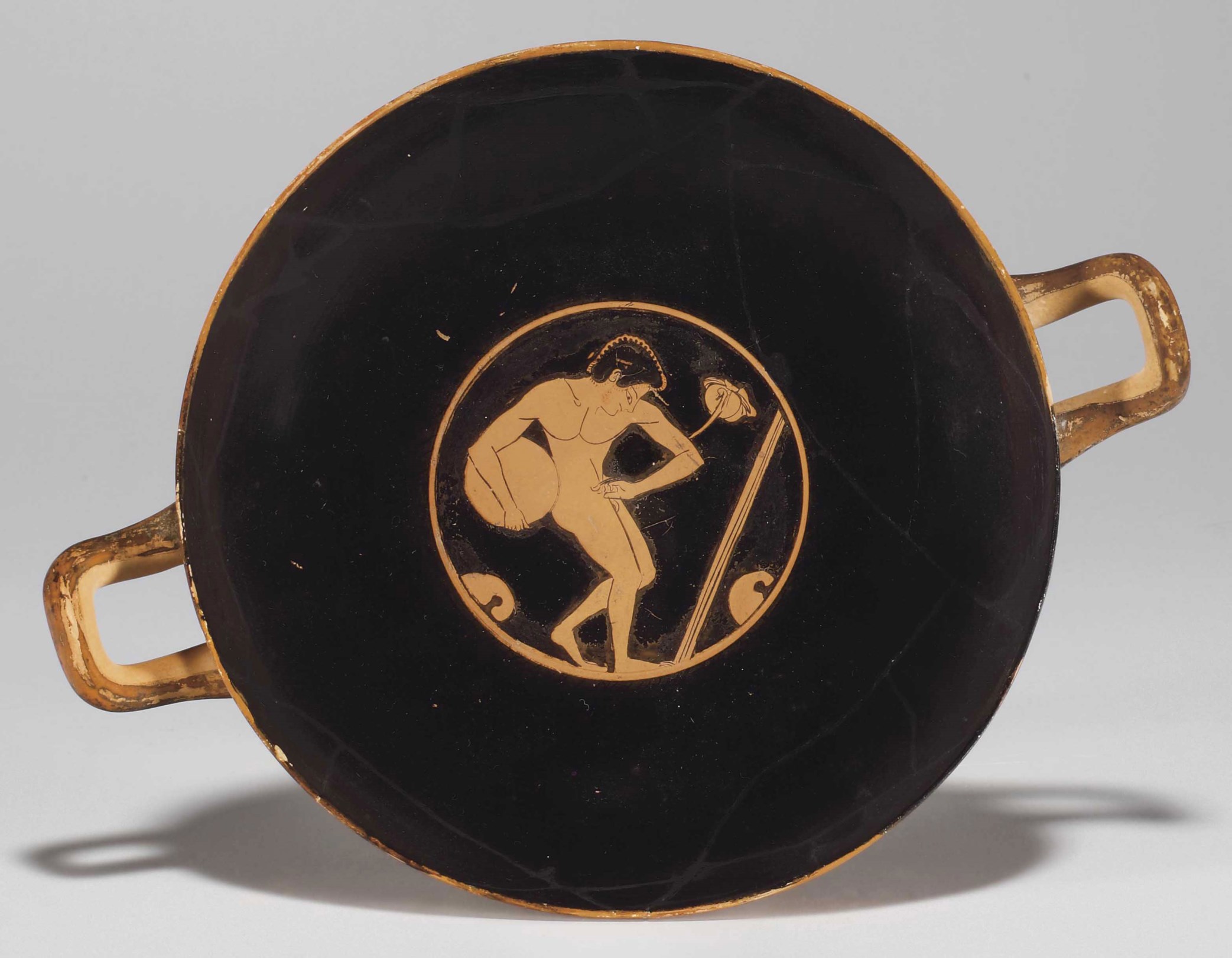 AN ATTIC REDFIGURED KYLIX , RELATED TO THE THALIA PAINTER, CIRCA LATE