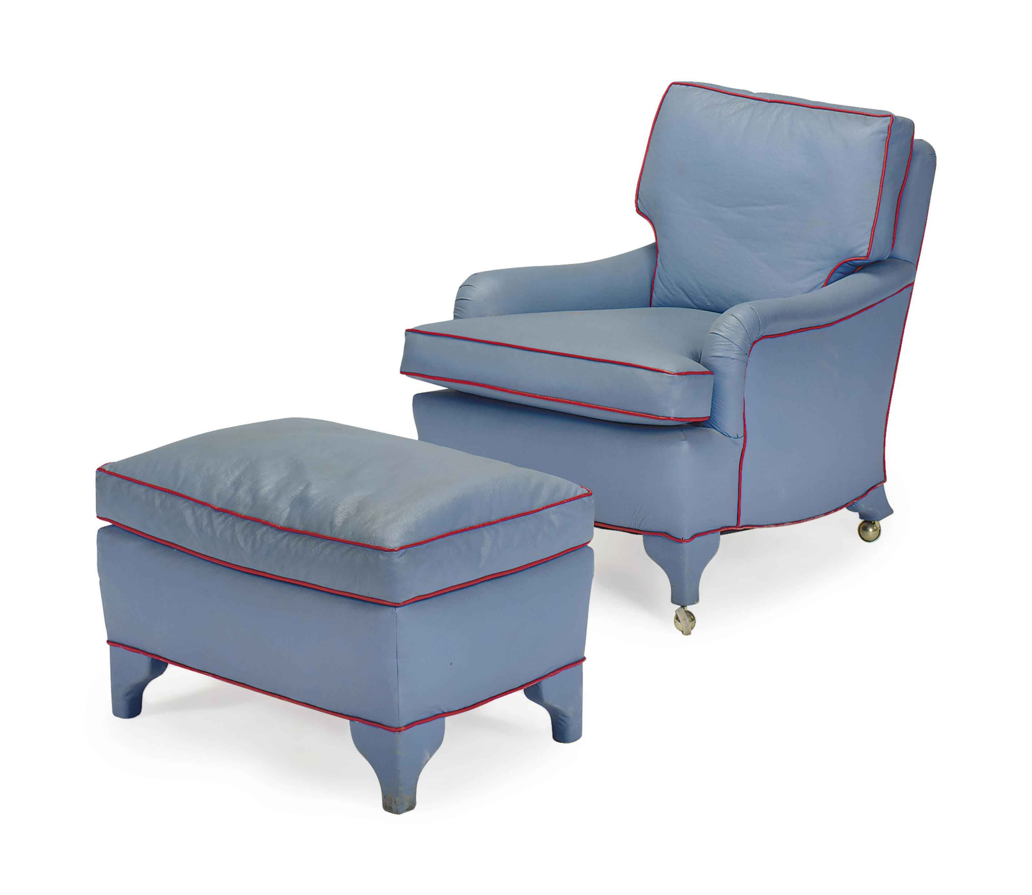 A BLUE VINYLUPHOLSTERED CLUB CHAIR AND OTTOMAN,