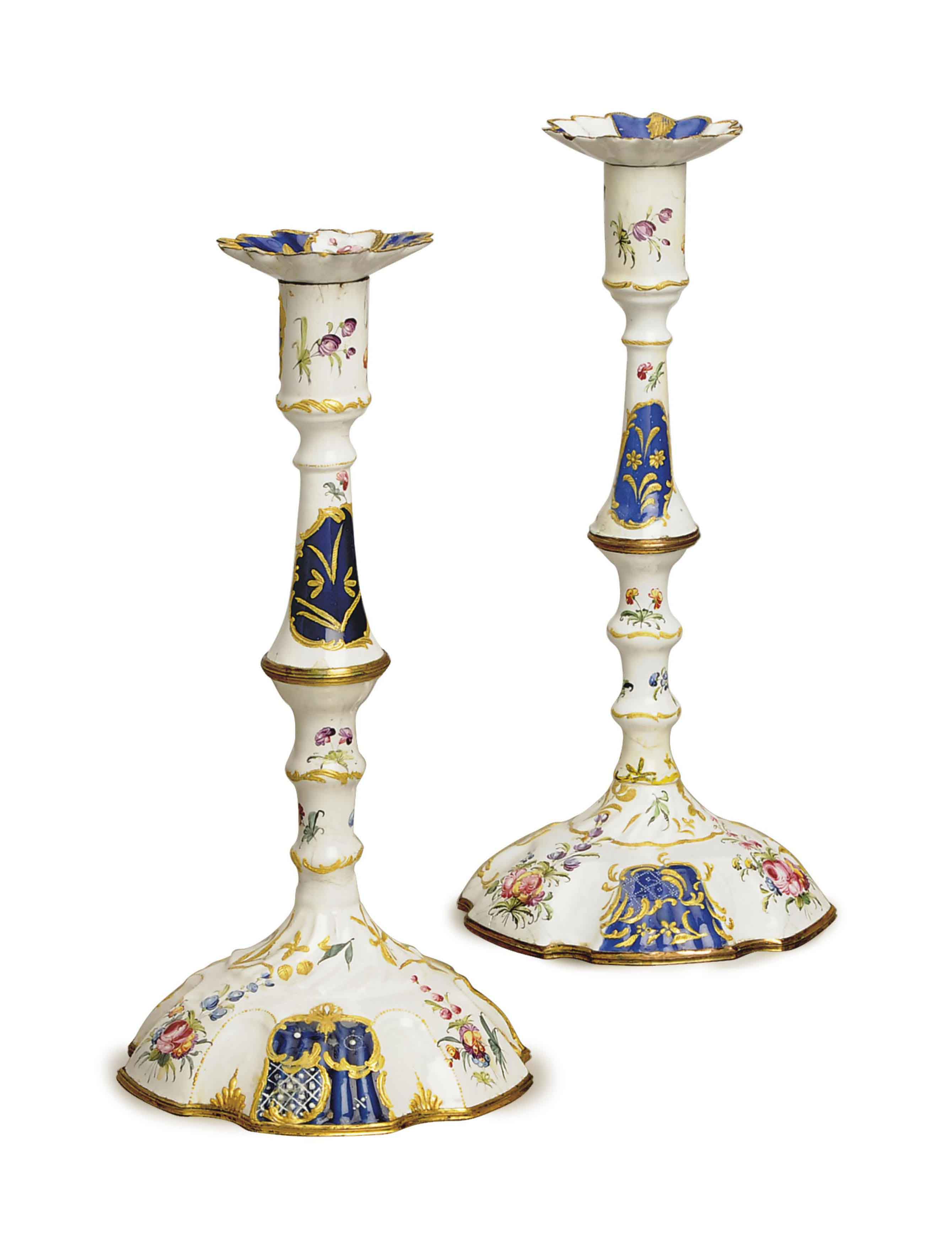 FOUR ENGLISH BLUE AND WHITE ENAMEL CANDLESTICKS Christie's