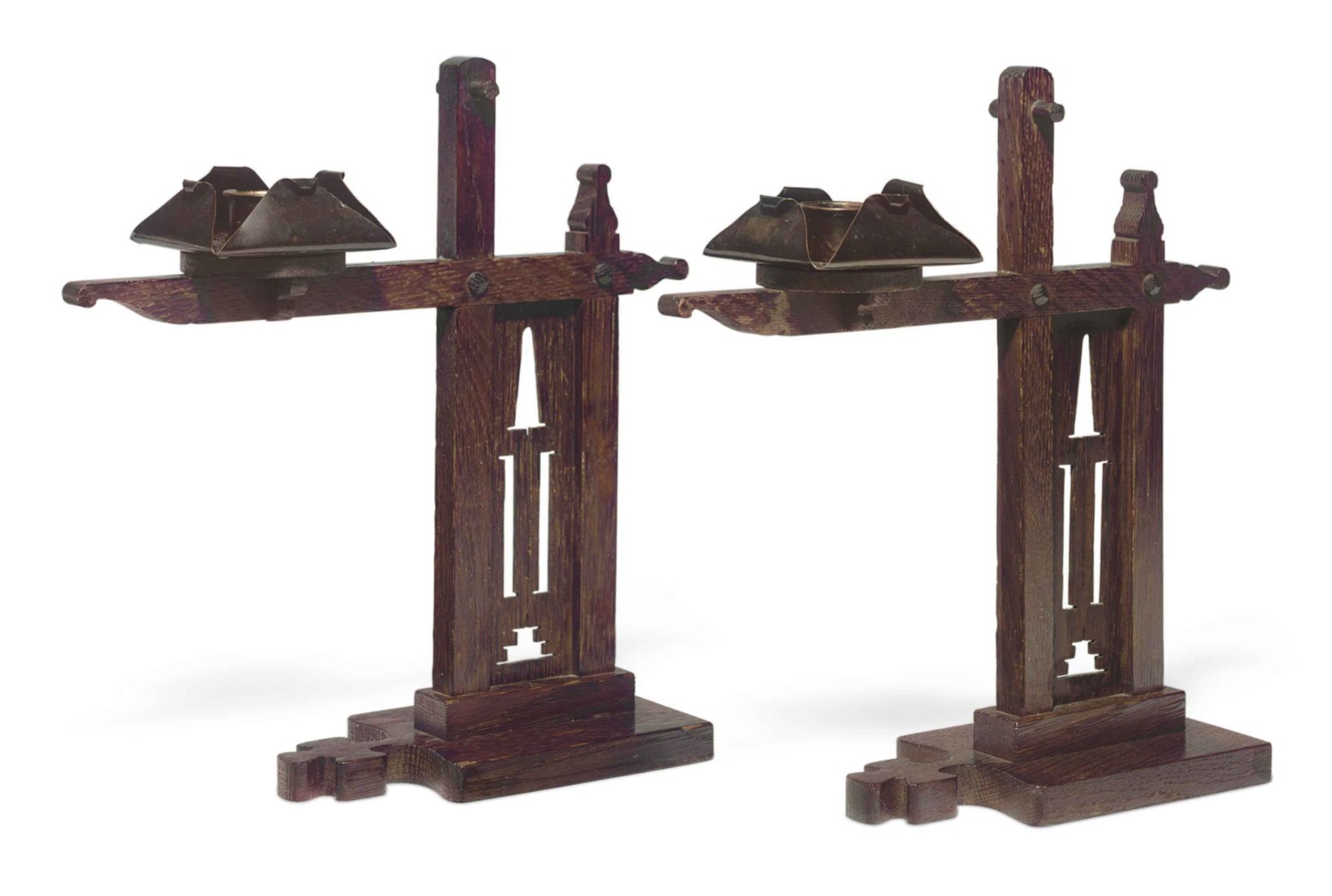 A PAIR OF ARTS AND CRAFTS OAK AND COPPER 'CRESSET' CANDLESTICKS ...