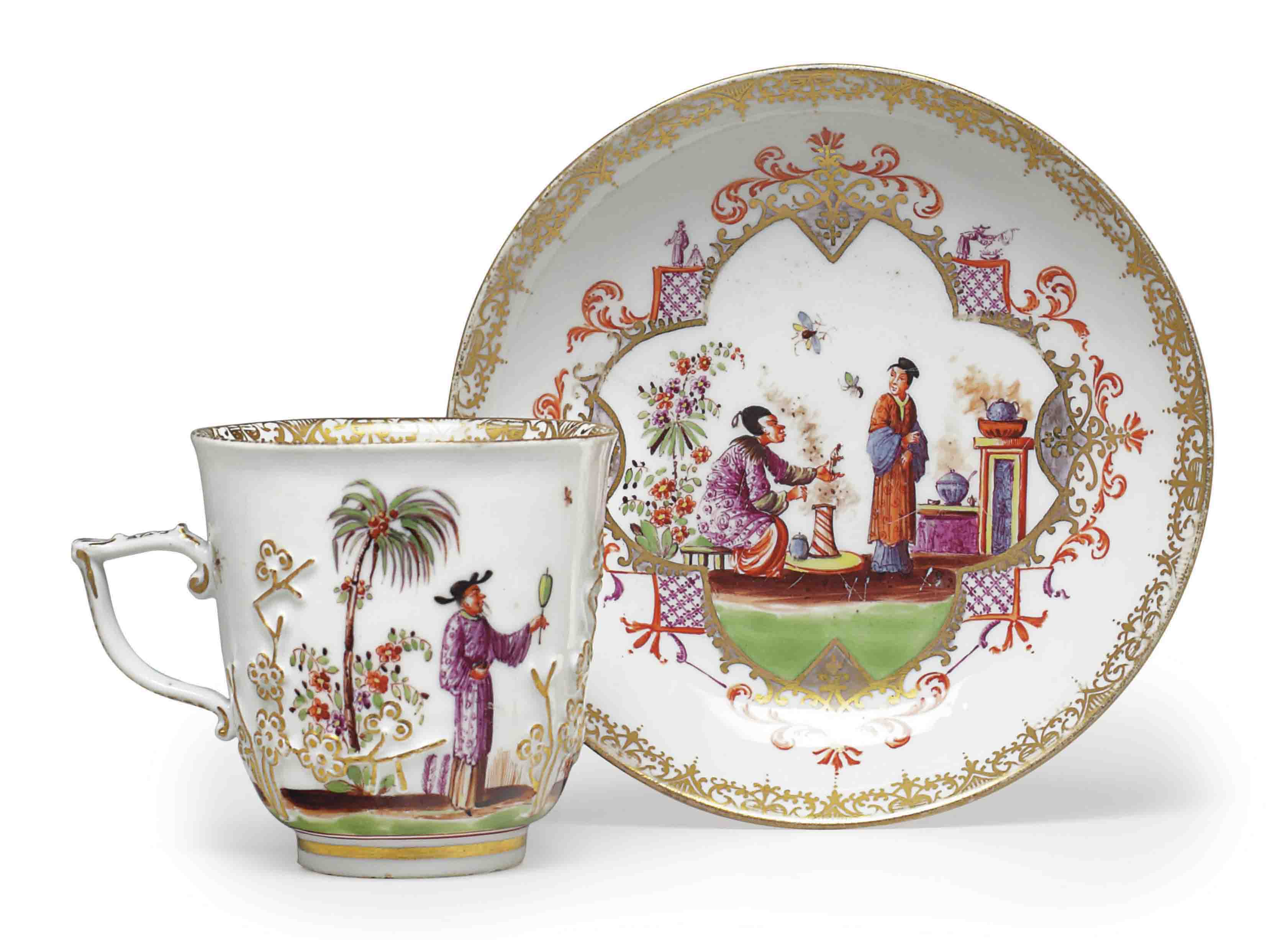 A MEISSEN PORCELAIN PRUNUSMOLDED CUP AND SAUCER , CIRCA 1740, BLUE