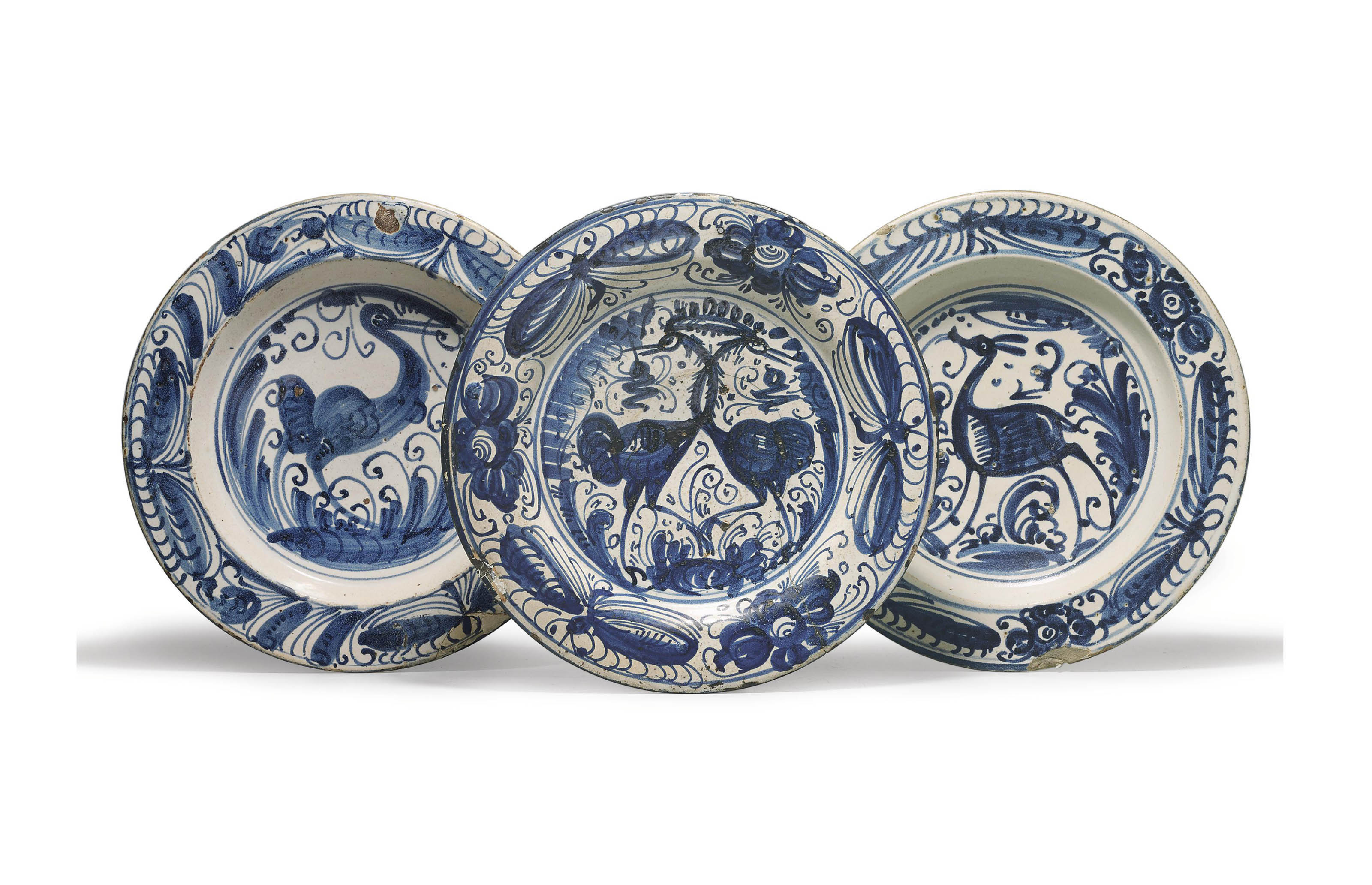 THREE SPANISH TINGLAZED EARTHENWARE BLUE AND WHITE DISHES