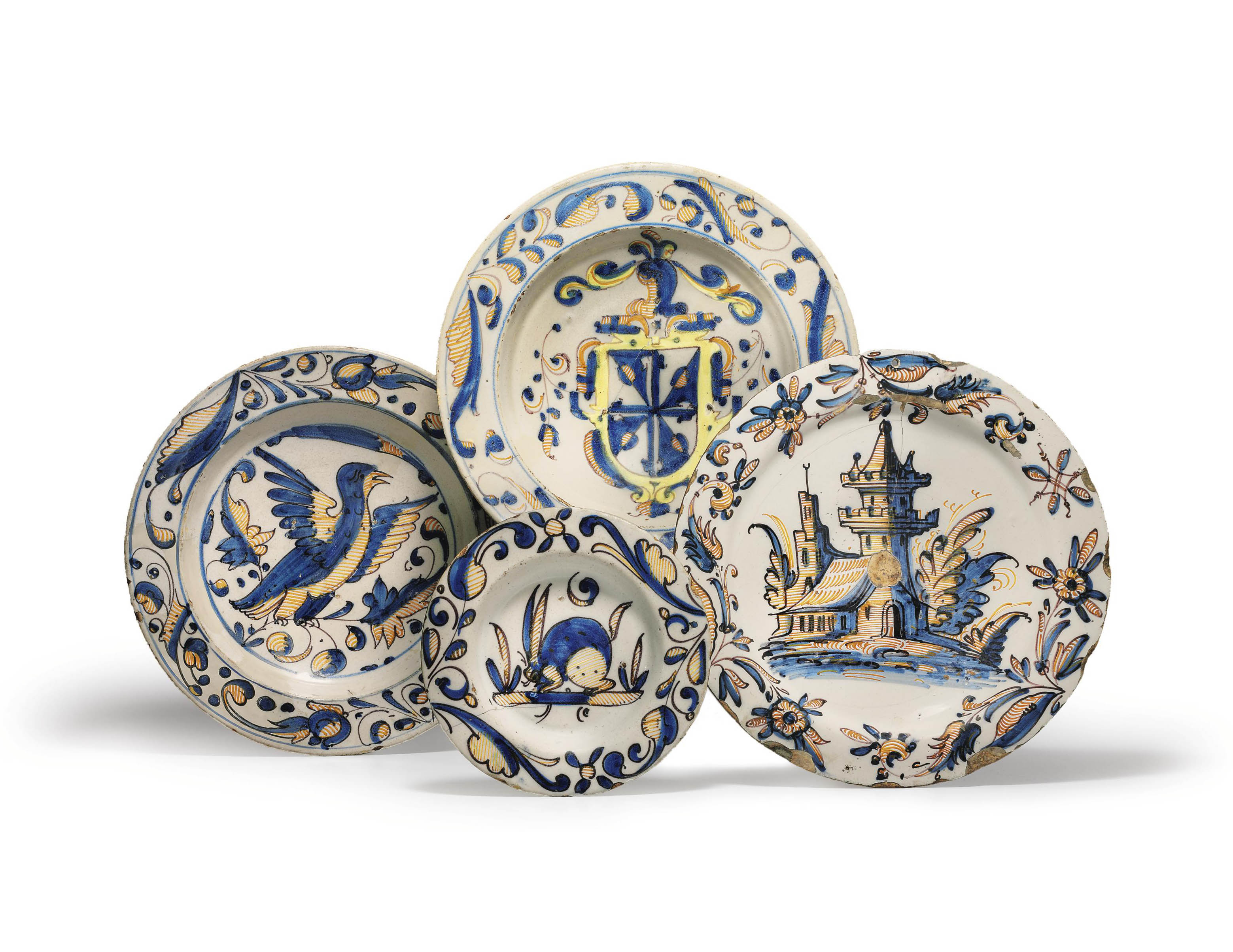 THREE SPANISH TINGLAZED EARTHENWARE LARGE DISHES AND A PLATE , CIRCA