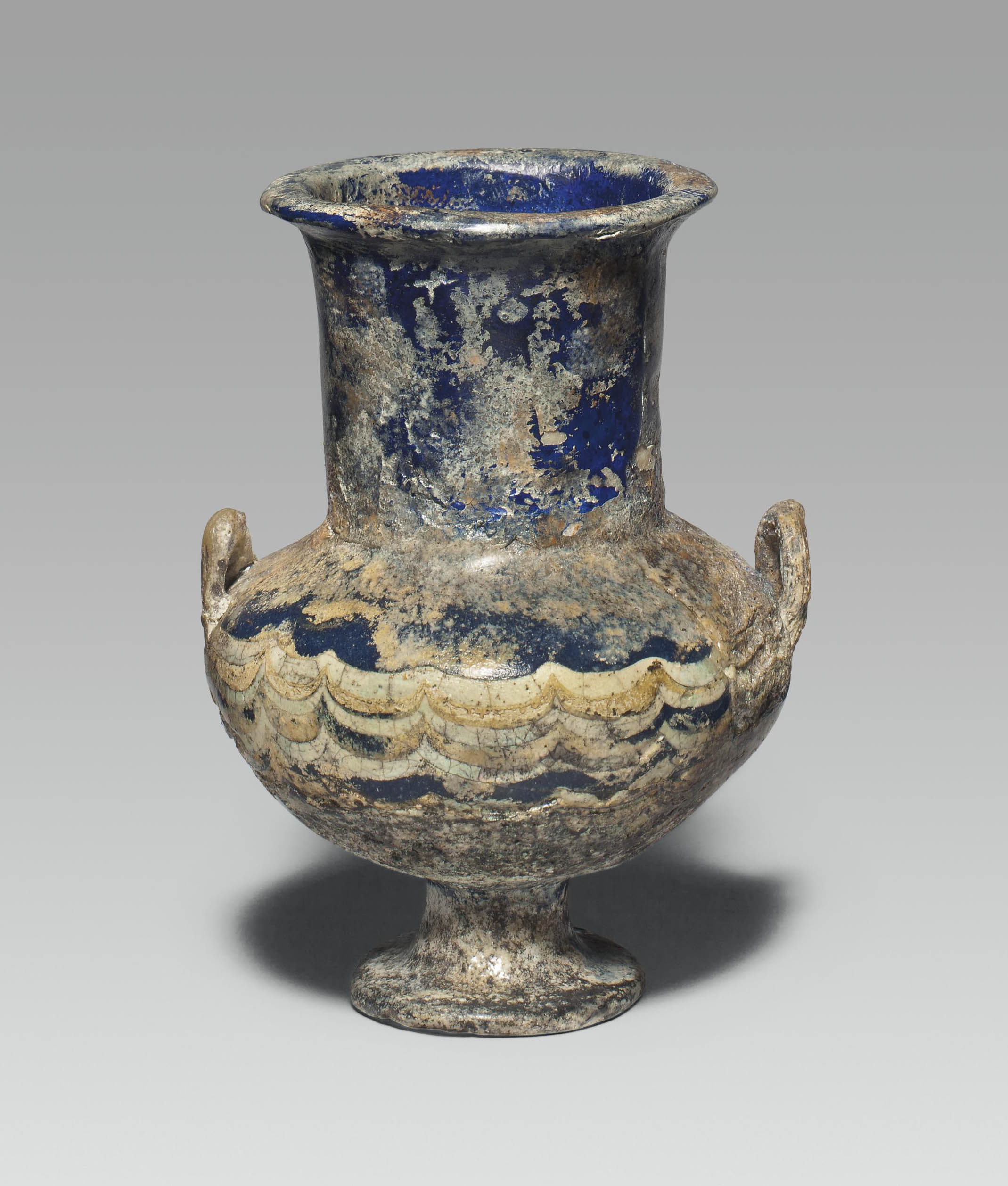 AN EGYPTIAN COREFORMED GLASS KRATERISKOS , NEW KINGDOM, DYNASTY XVIII
