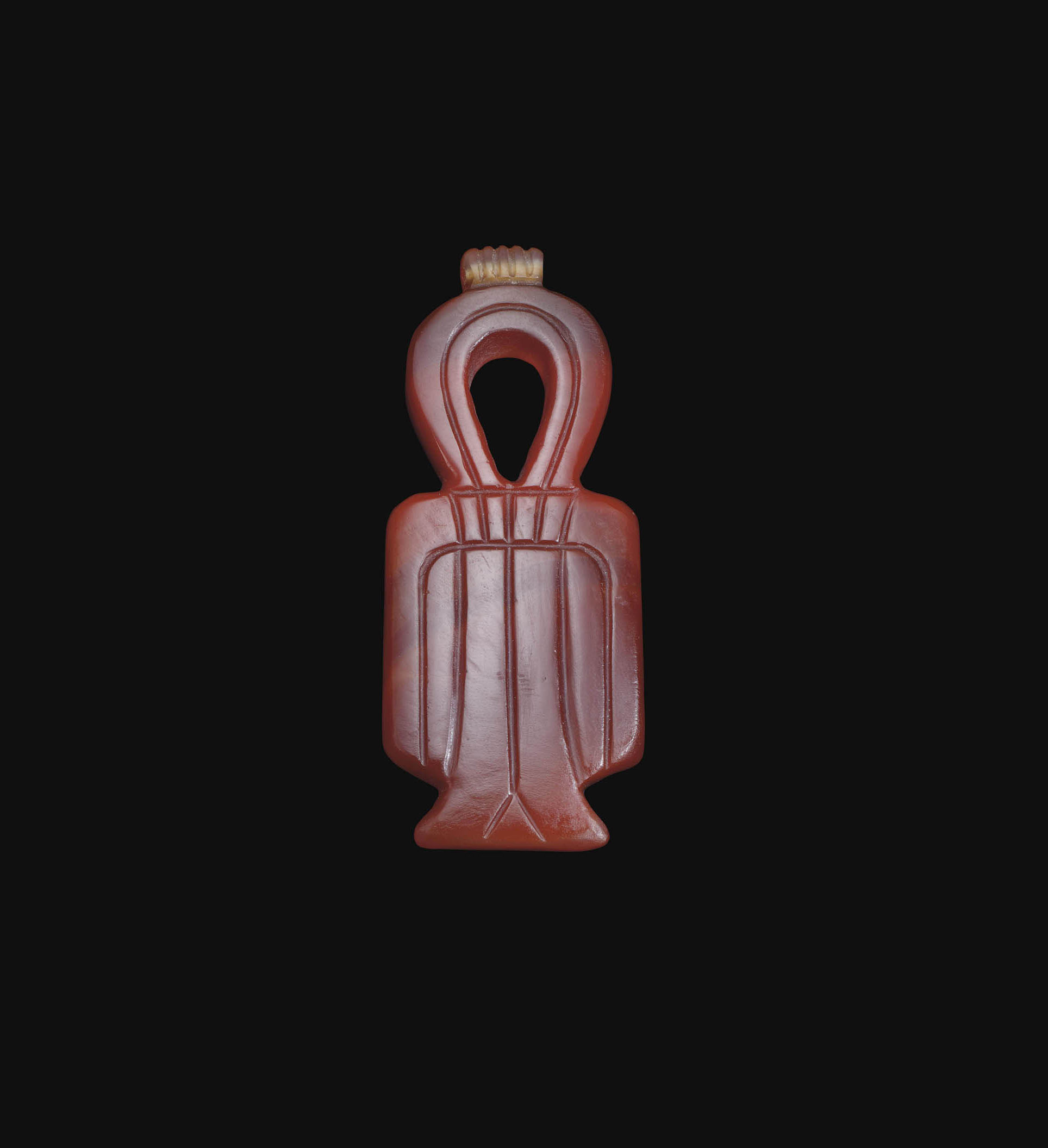 AN EGYPTIAN CARNELIAN TYET AMULET , NEW KINGDOM, DYNASTY XIXXX, 1307