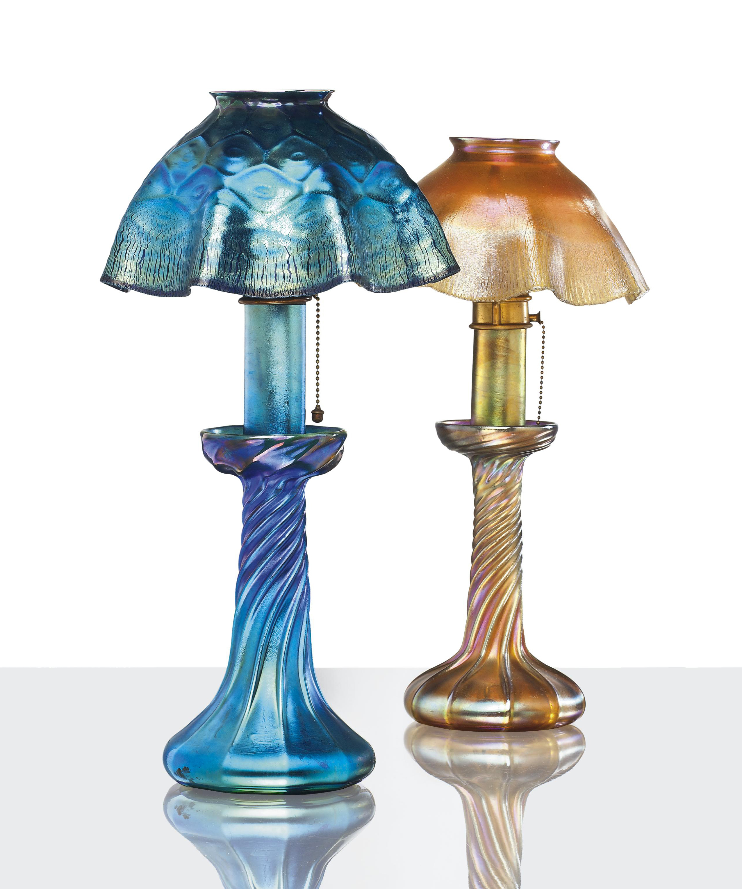 TIFFANY STUDIOS , TWO FAVRILE GLASS CANDLE LAMPS, CIRCA 1910 Christie's