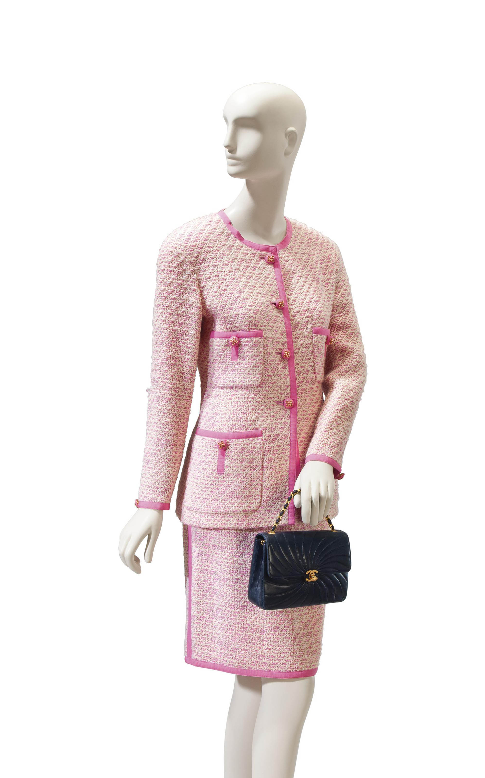 A CHANEL PINK AND WHITE WOOL BLEND SUIT WITH A CHANEL NAVY LEATHER