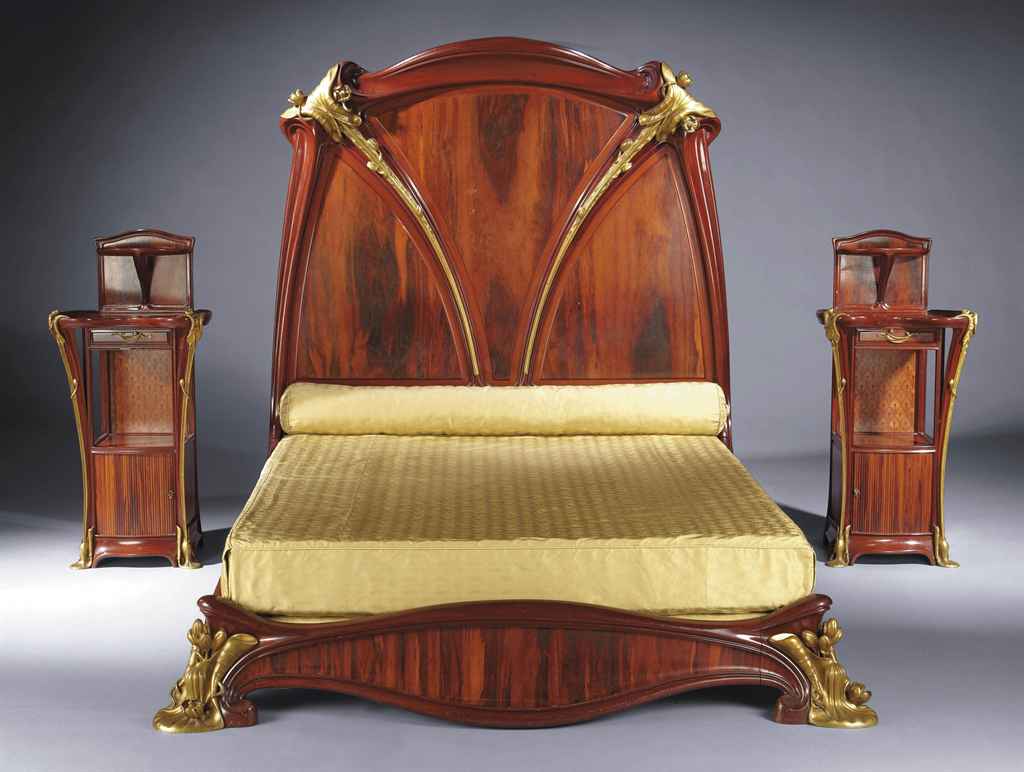 Louis Majorelle (1859-1926), Grand lit et paire de chevets 'aux N&eacute;nuphars', c. 1905.  74&frac14; in (188.5 cm) high, 89 in (226 cm) long), 70&frac34; in (179.5 cm) width. Sold for &euro;1,162,600 on 31 March 2011 in Les Collections du Chateau de Gourdon at Christie&rsquo;s in Paris
