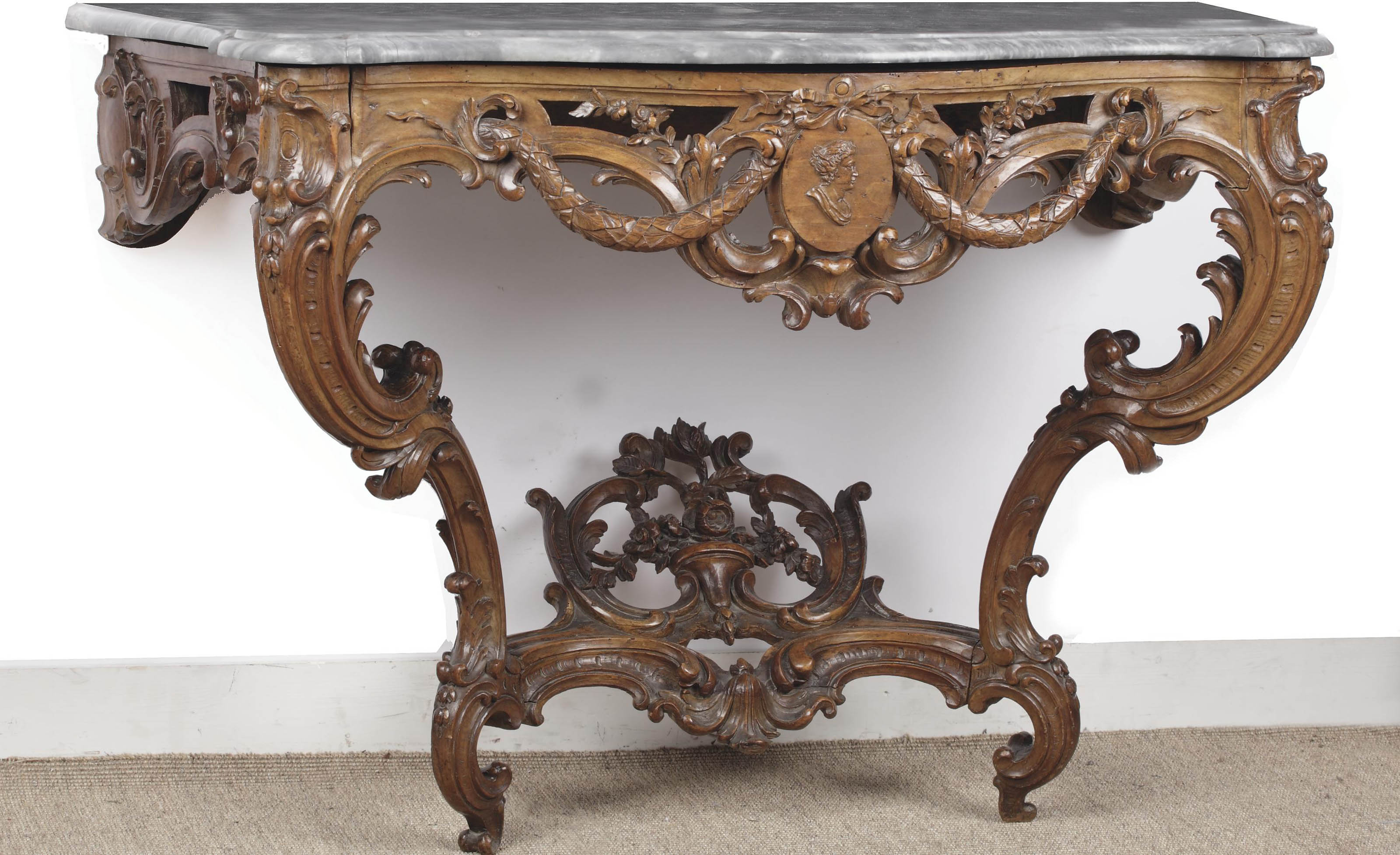 A French provincial carved fruitwood console table