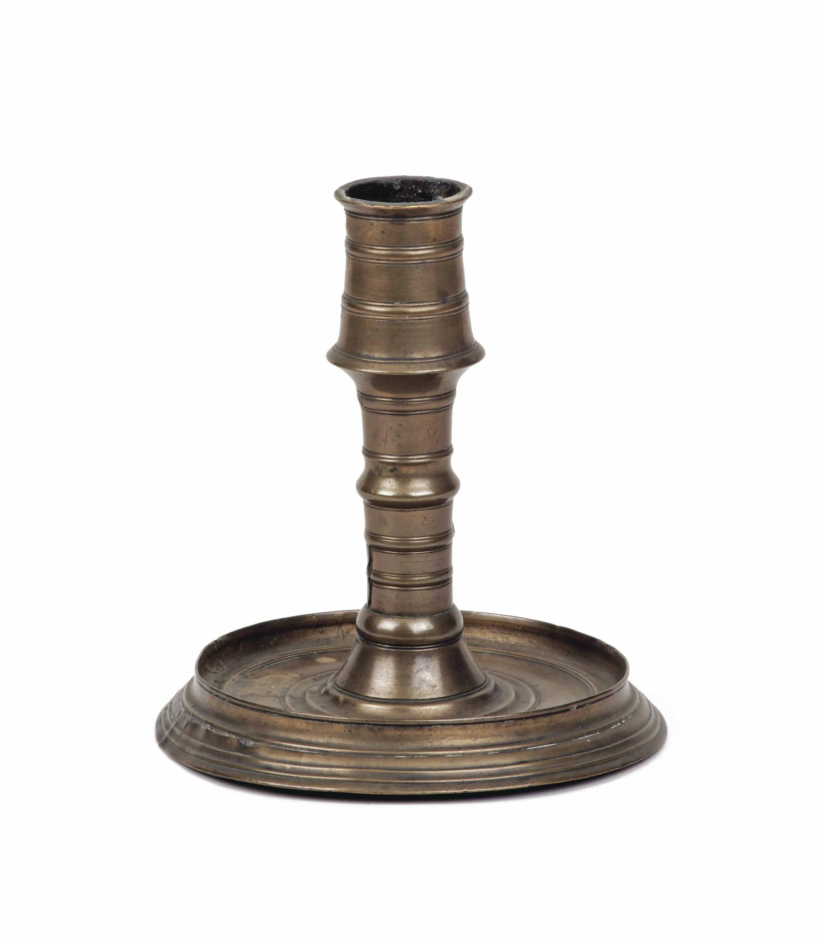 A GERMAN BRASS CANDLESTICK , 16TH CENTURY Christie's
