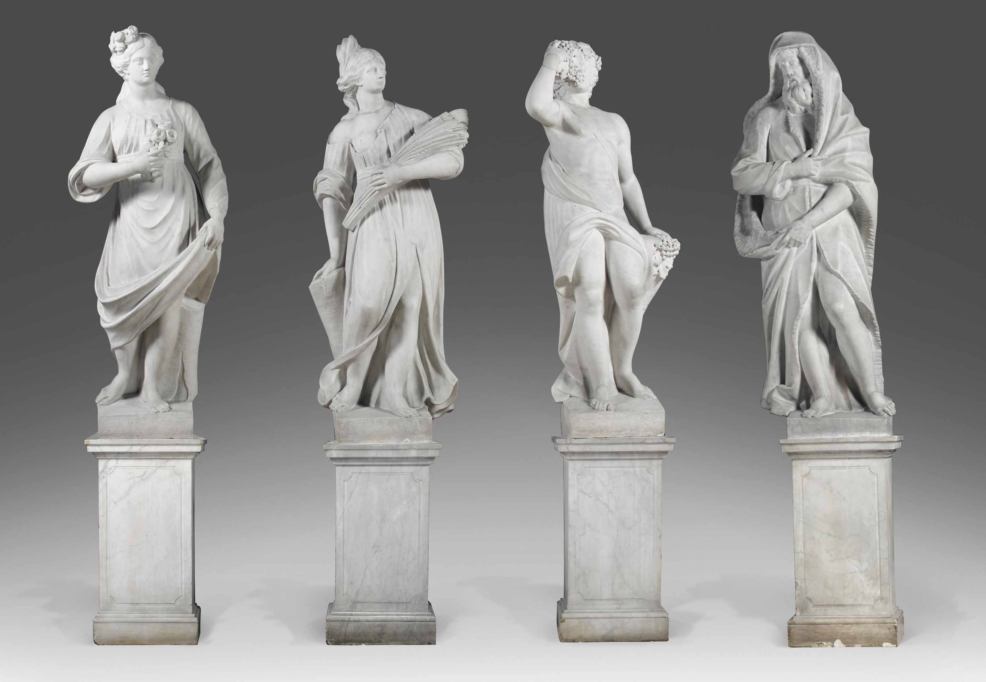 A GROUP OF FOUR ITALIAN CARVED WHITE MARBLE ALLEGORICAL FIGURES 'FOUR