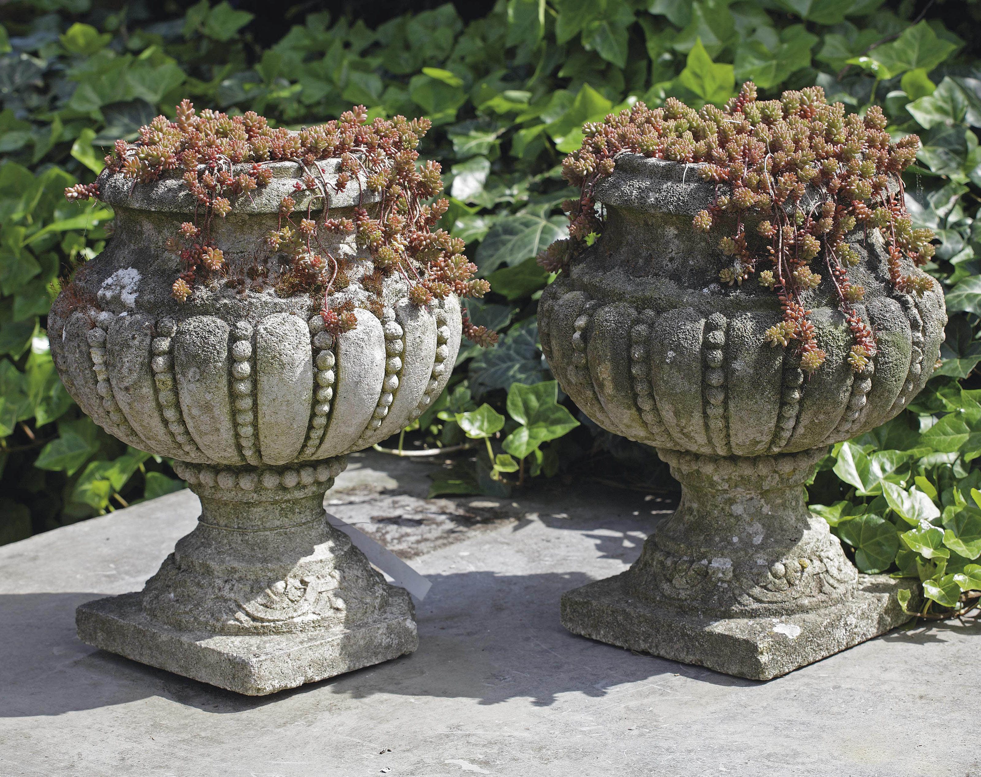 A pair of carved limestone planters Christie's