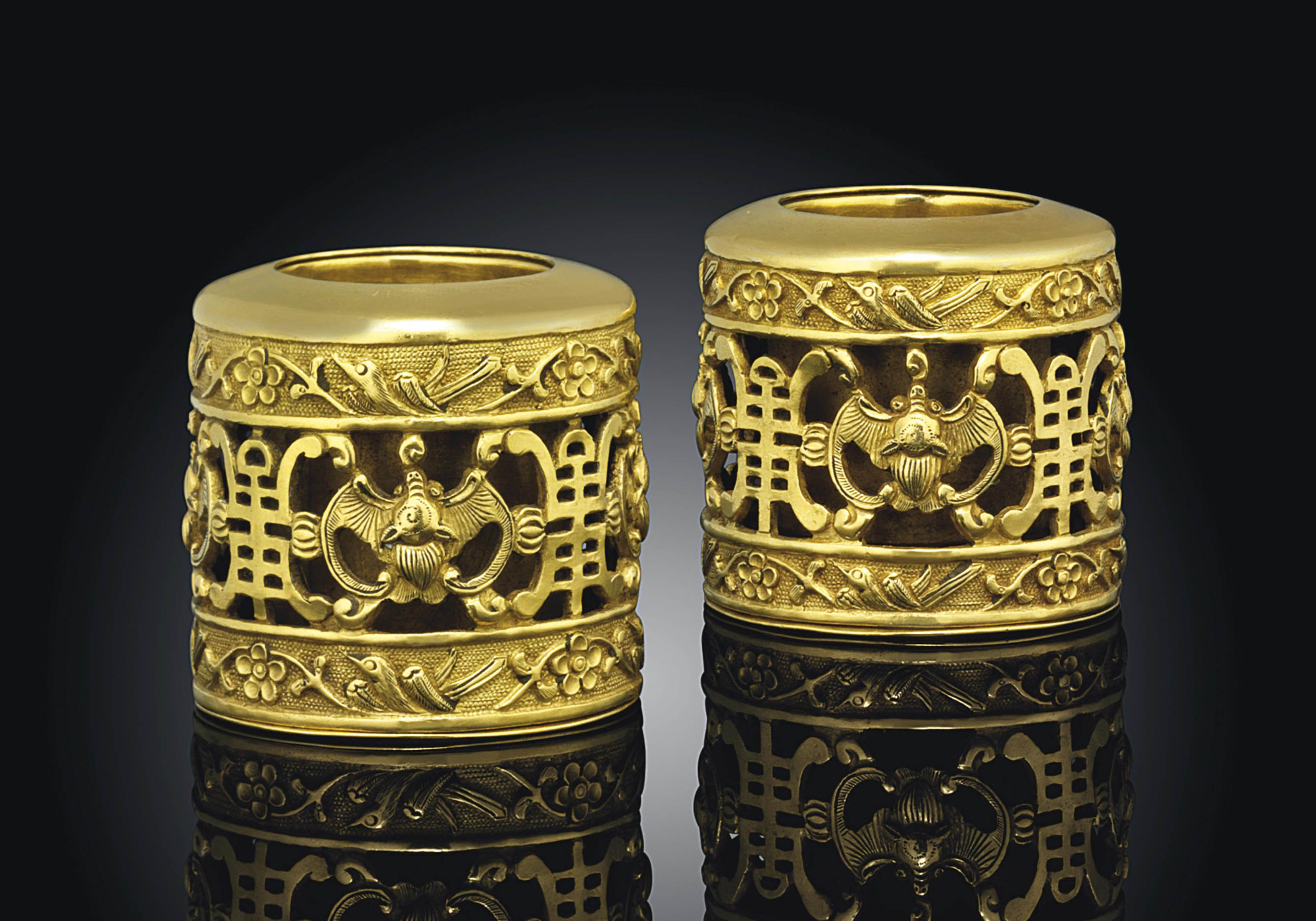 TWO GOLD PIERCED ARCHERS' RINGS , 19TH CENTURY Christie's