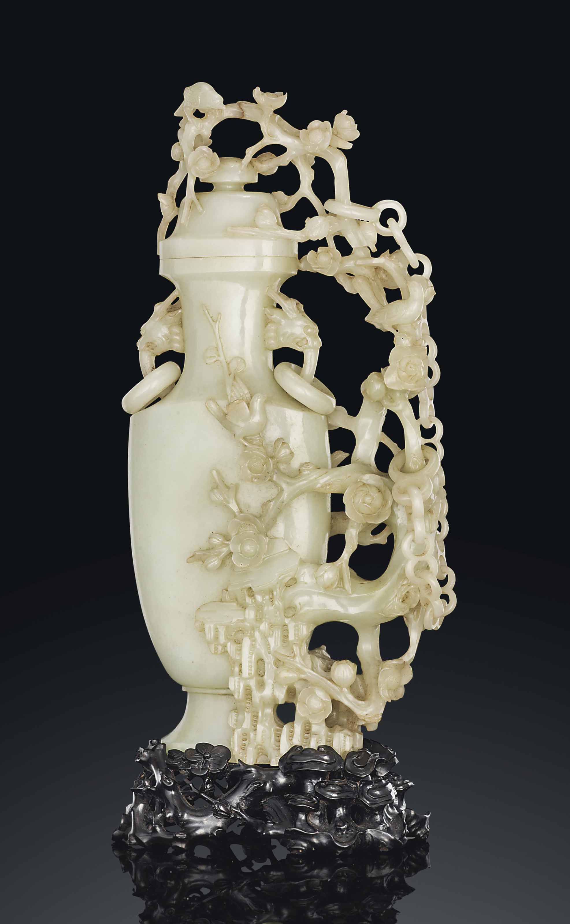 A PALE CELADON JADE 'PRUNUS' VASE AND COVER , 18TH/19TH CENTURY