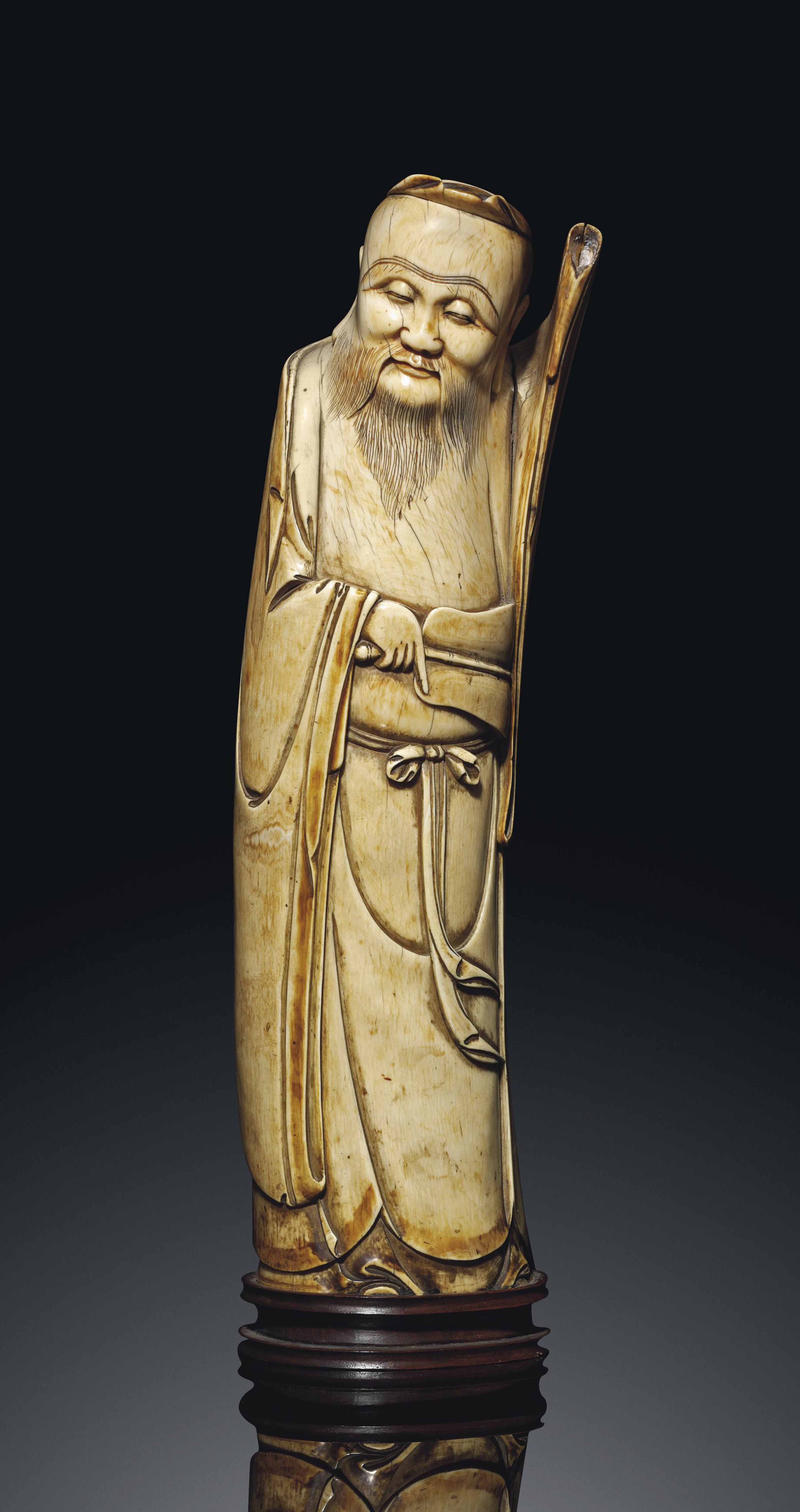 A LARGE IVORY CARVING OF AN IMMORTAL , LATE MING DYNASTY, 17TH CENTURY