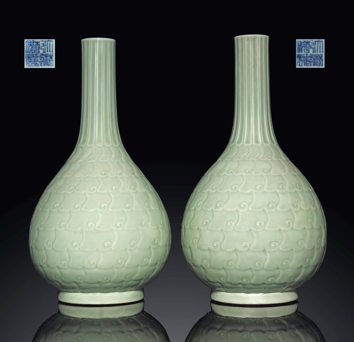 A PAIR OF CELADONGLAZED MOULDED BOTTLE VASES , QIANLONG UNDERGLAZE