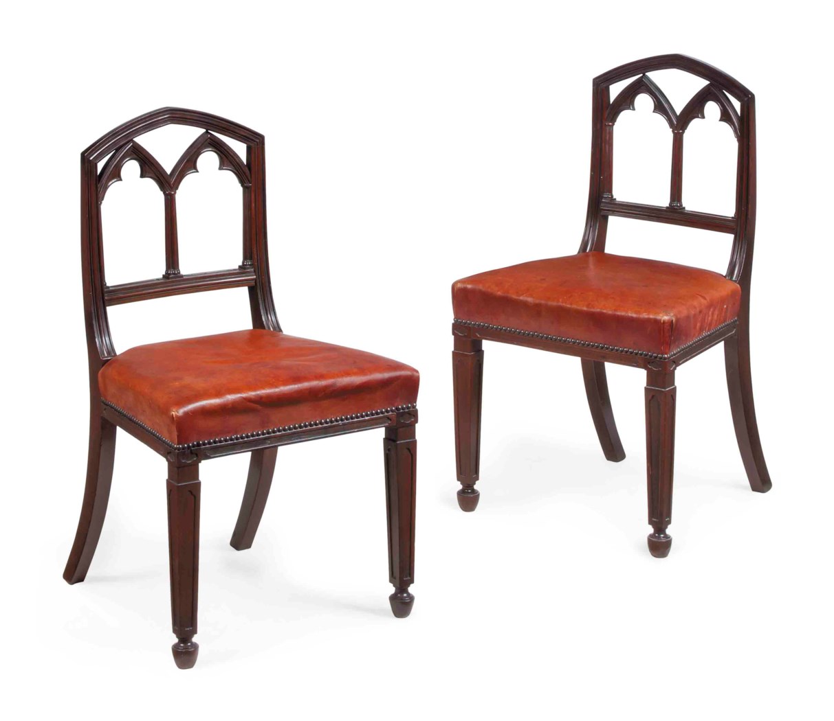 A PAIR OF REGENCY LEATHER-UPHOLSTERED MAHOGANY SIDE CHAIRS