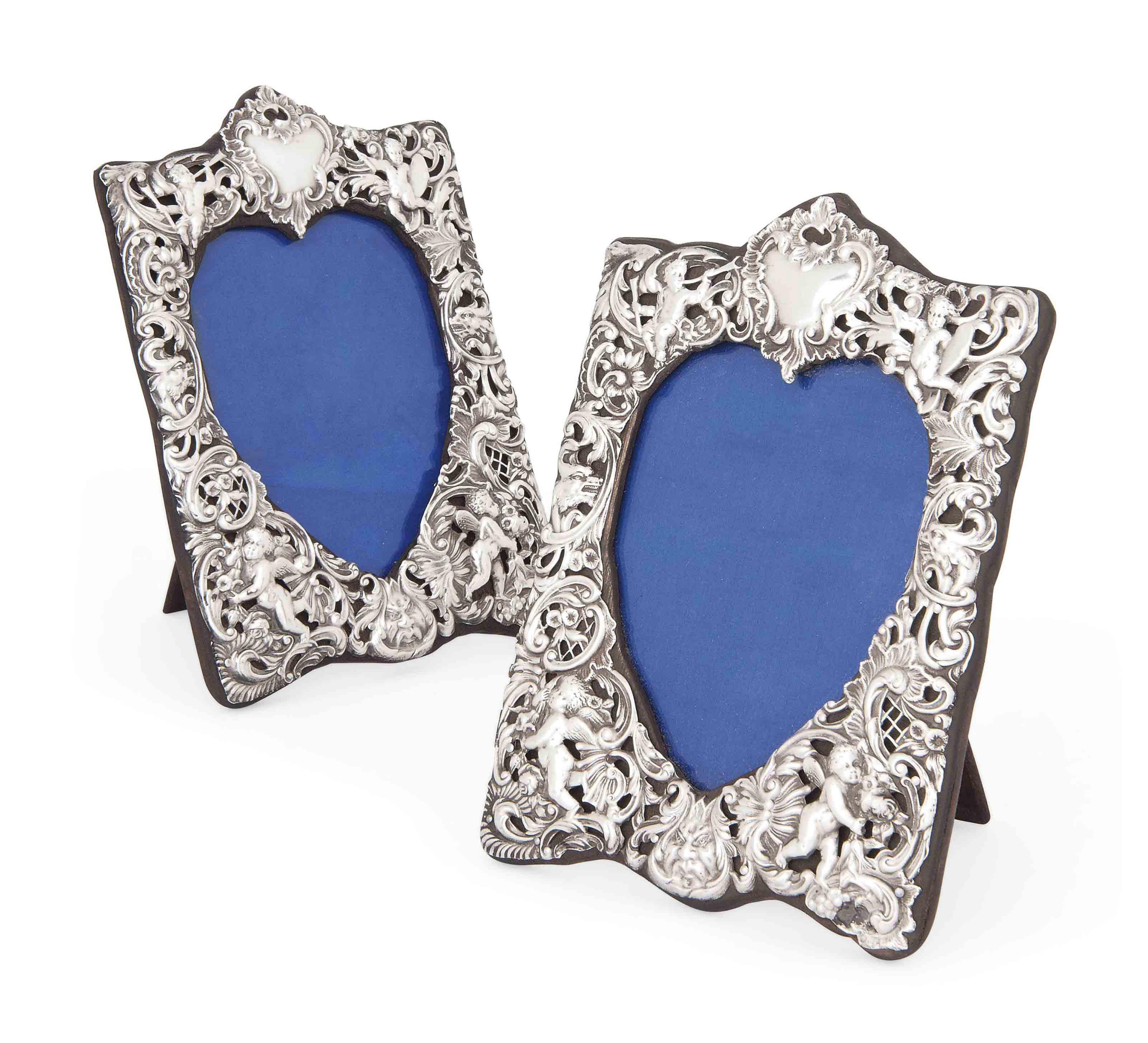 A PAIR OF LATE VICTORIAN SILVER PHOTOGRAPH FRAMES