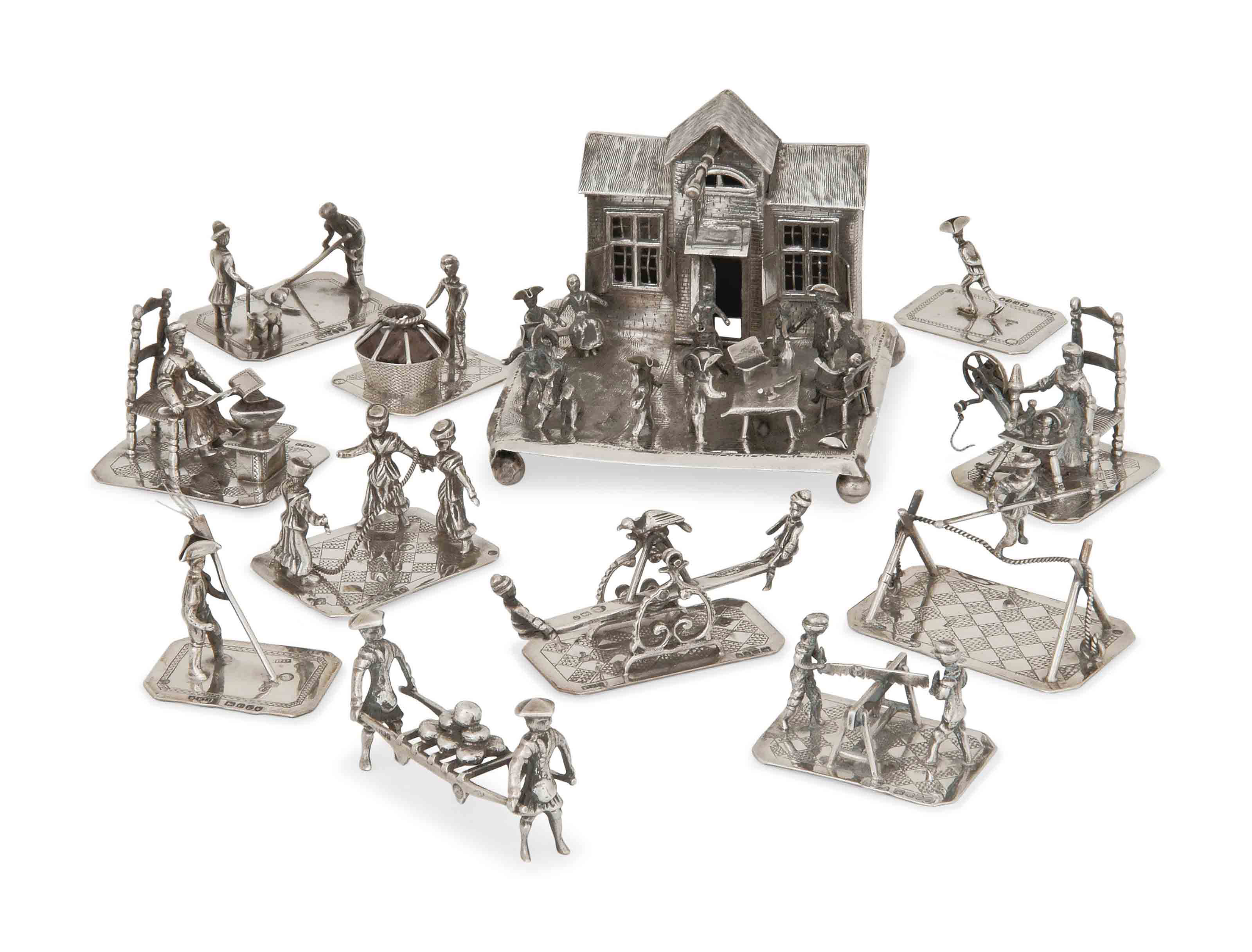 A GROUP OF TWELVE DUTCH SILVER TOYS