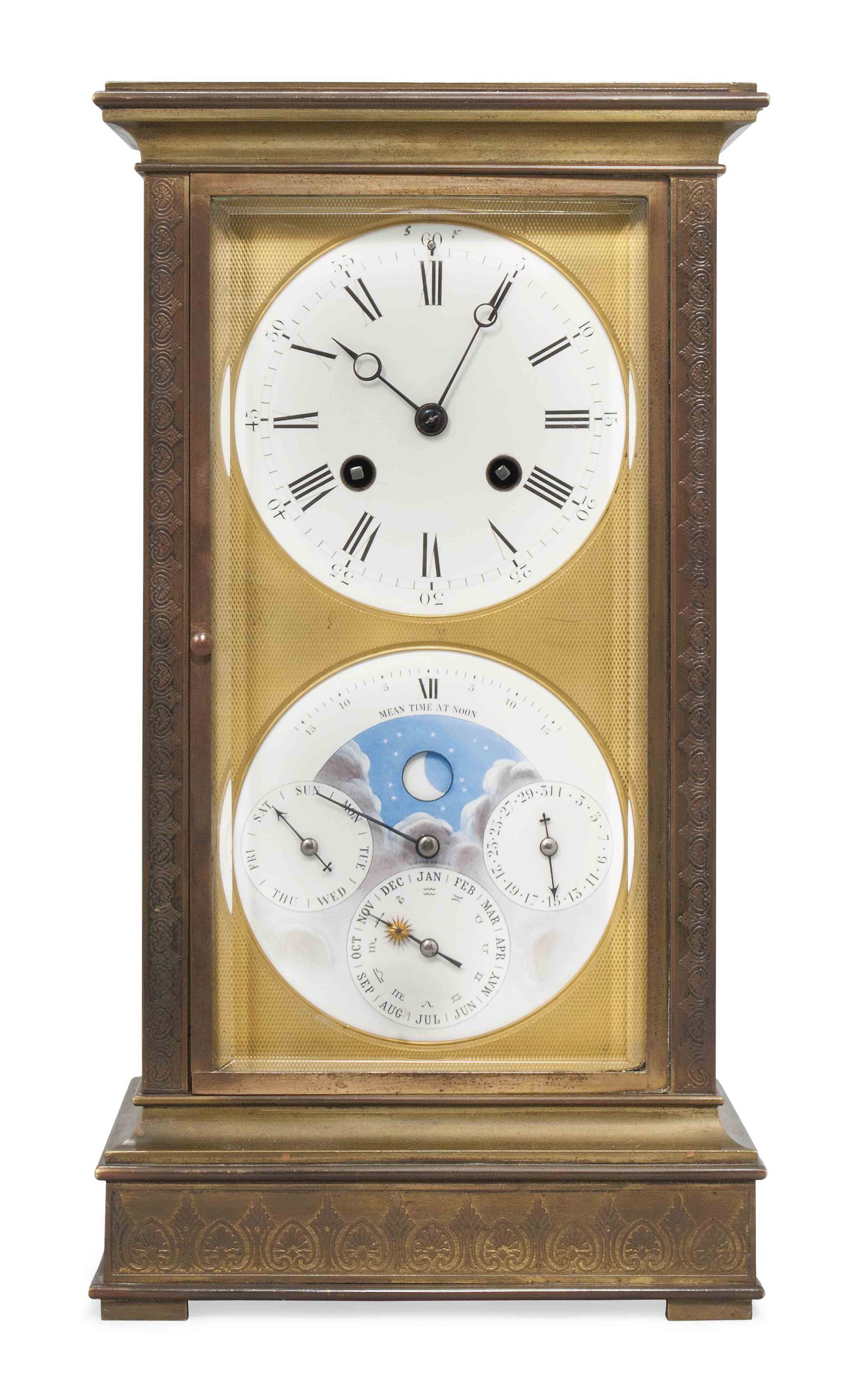 AN ENGRAVED BRASS PERPETUAL CALENDAR CLOCK