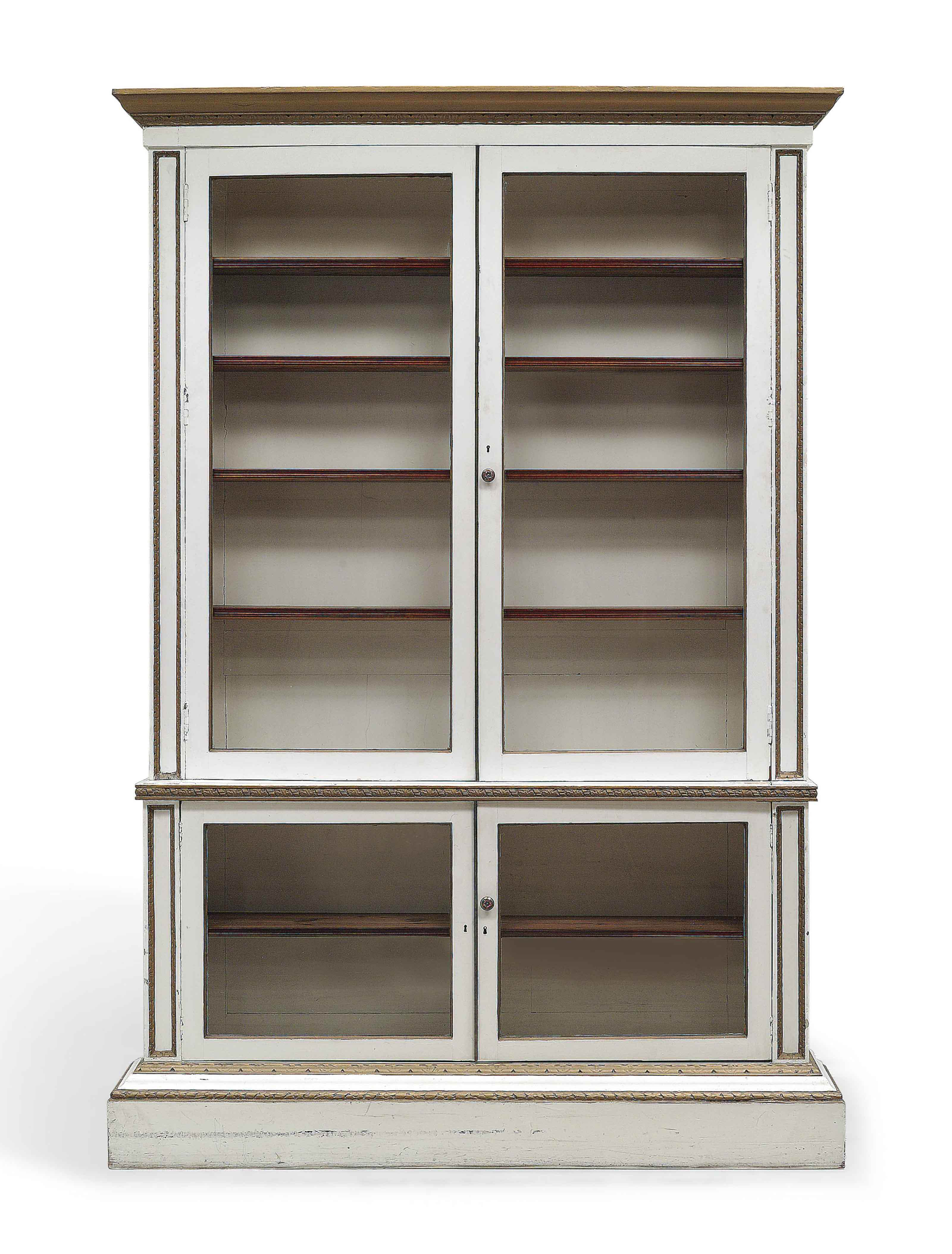 A GEORGE II WHITE PAINTED AND PARCEL-GILT LIBRARY BOOKCASE ...