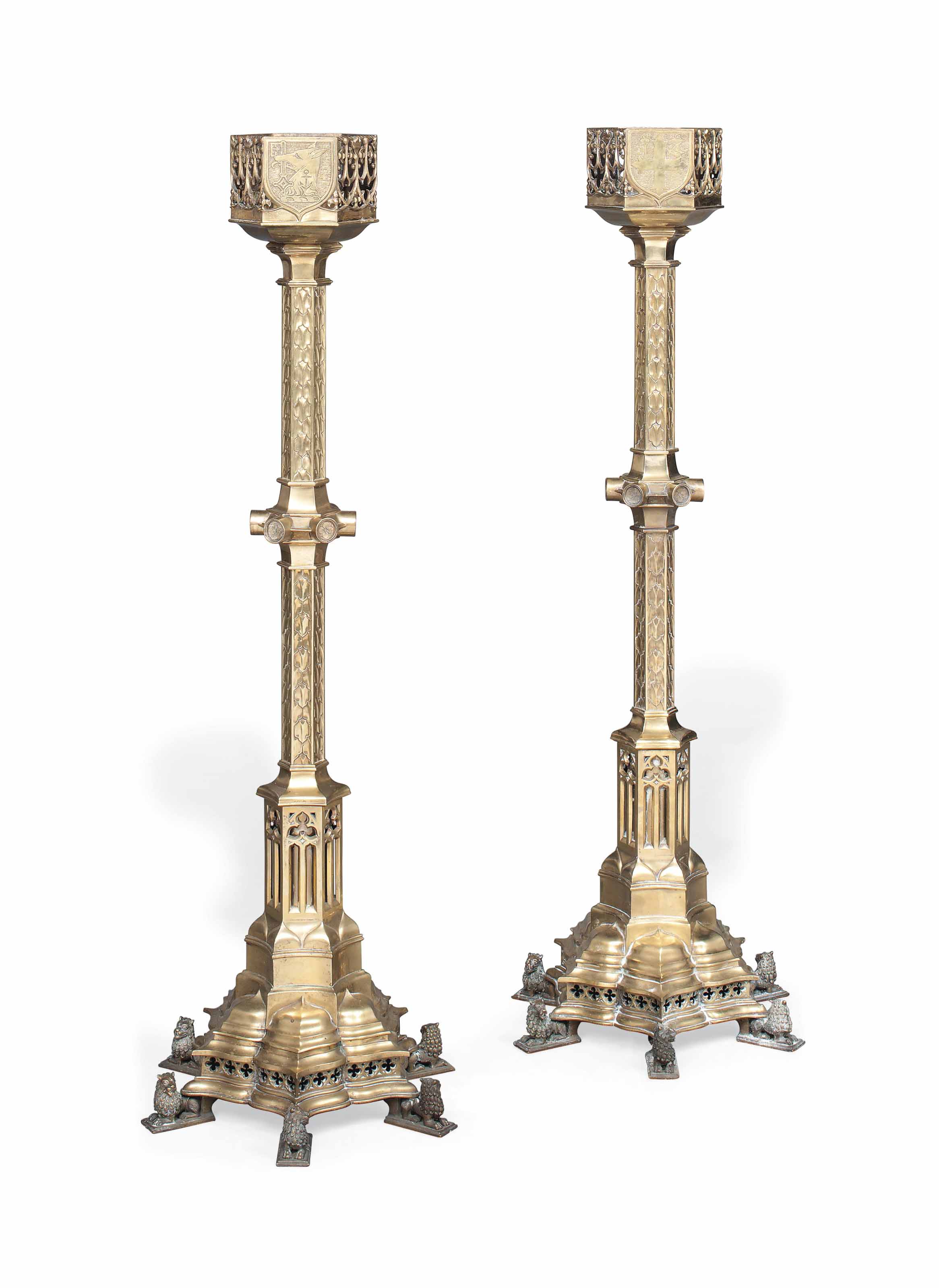 A Pair Of Victorian Brass Floor Standing Candlesticks Attributed