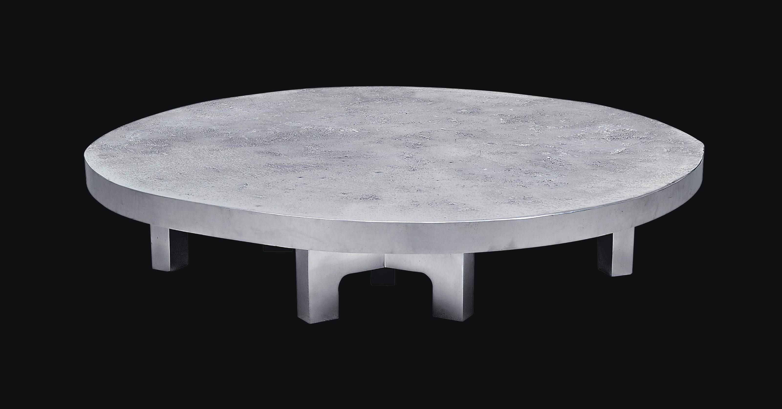 A Cast Aluminium Luna Table Ado chale furniture tables and other objects remain popular today. a cast aluminium luna table