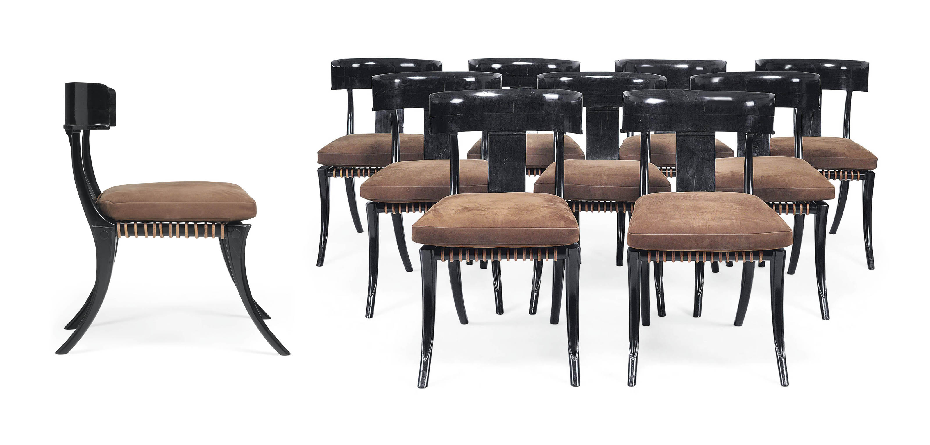 A Set Of Twelve Ebony Klismos Dining Chairs