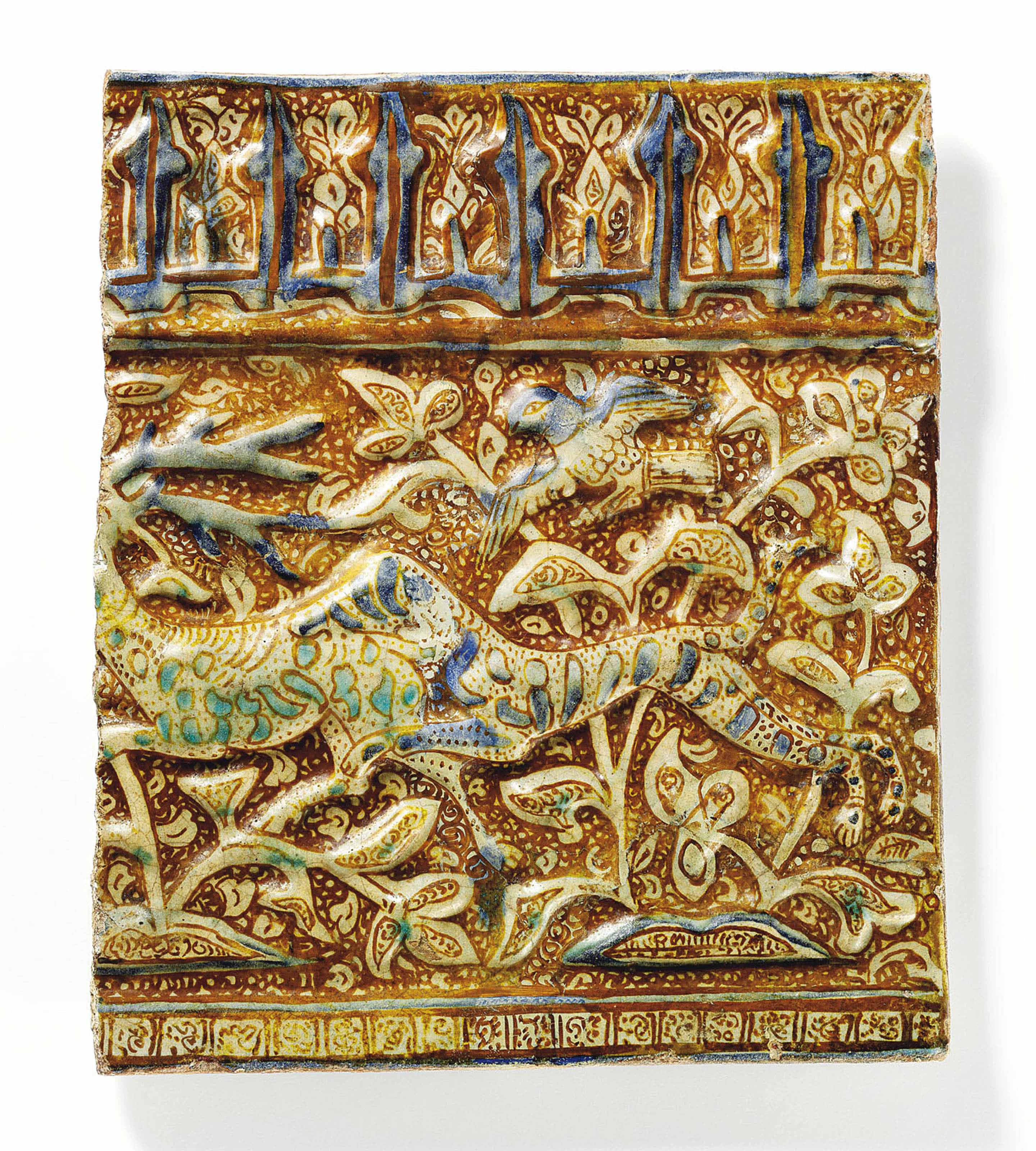 AN ILKHANID COBALT-BLUE, TURQUOISE AND LUSTRE MOULDED POTTERY TILE