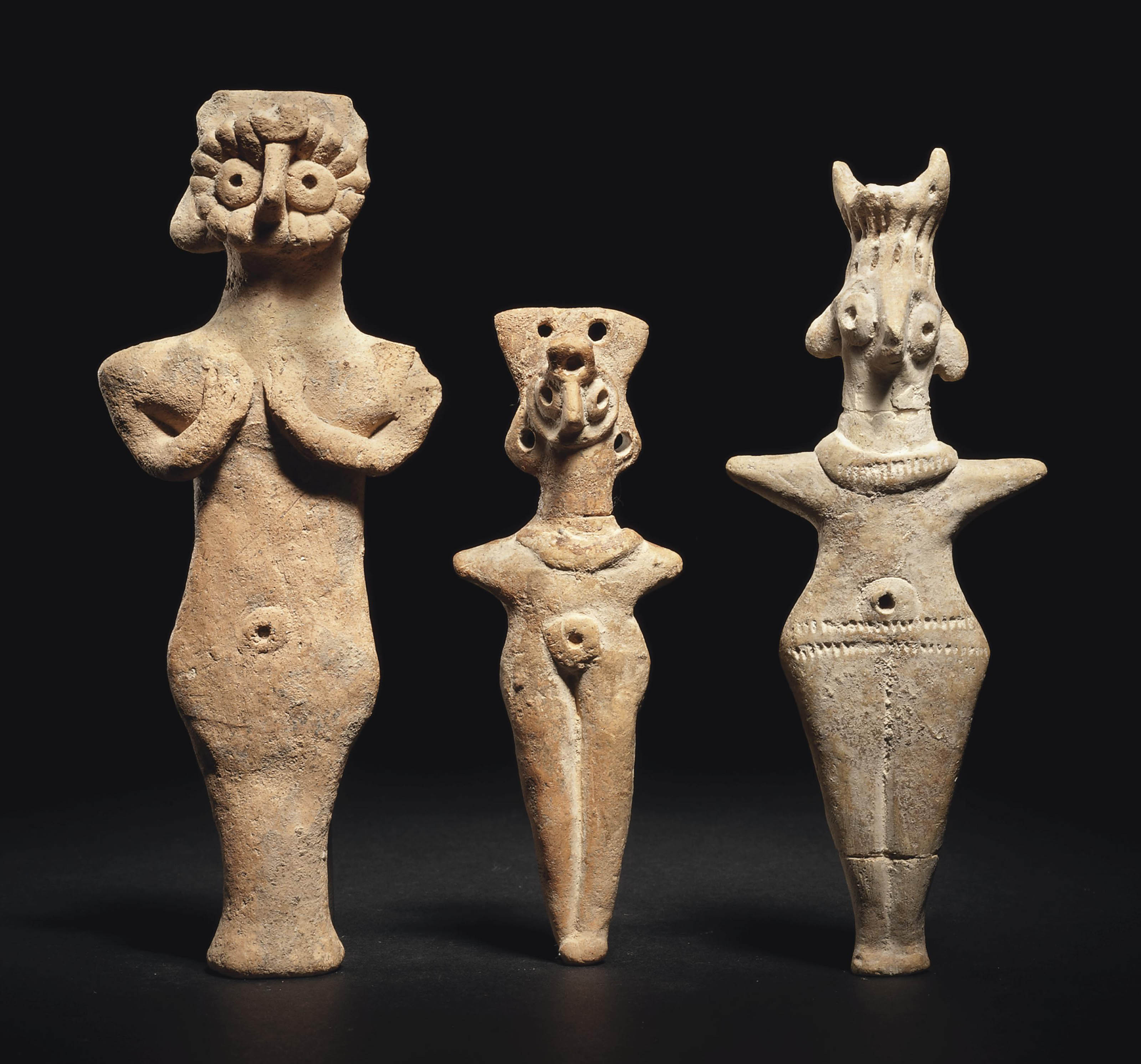 THREE SYRIAN TERRACOTTA IDOLS , CIRCA 2ND MILLENNIUM B.C. Christie's