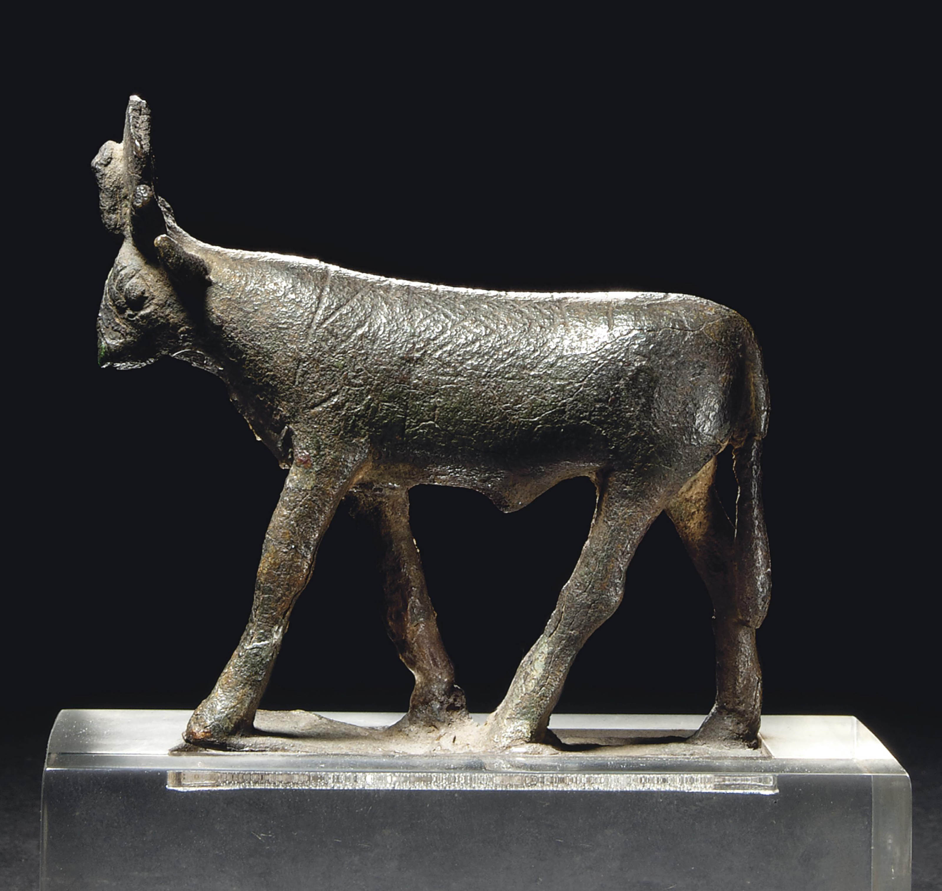 AN EGYPTIAN BRONZE APIS BULL