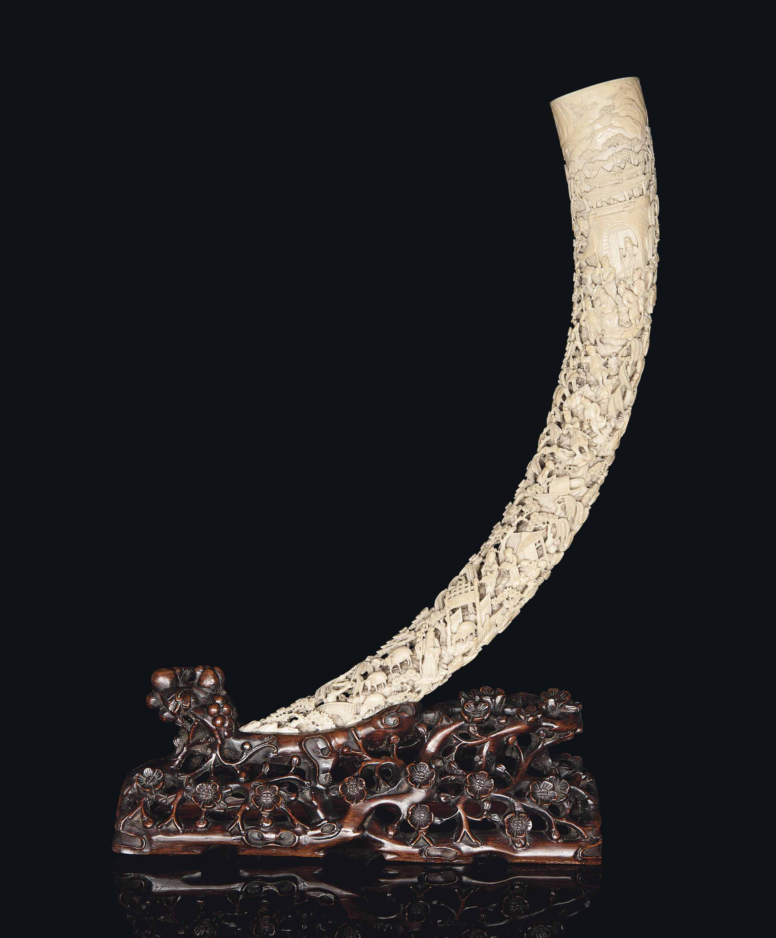 A LARGE CARVED AND PIERCED IVORY TUSK , CIRCA 1820 Christie's