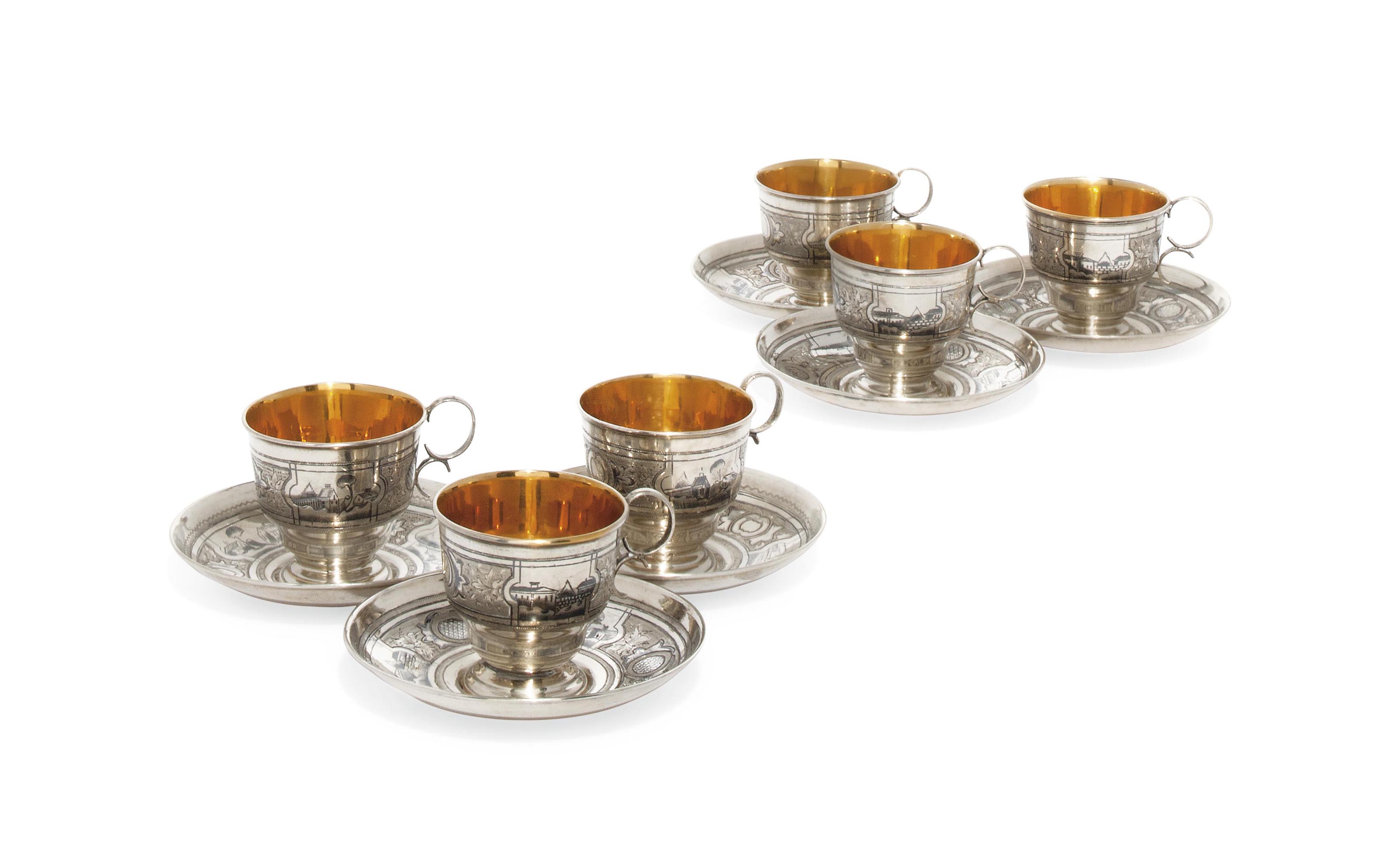 A SET OF SIX RUSSIAN SILVER AND NIELLO COFFEE CUPS AND SAUCERS , MARK
