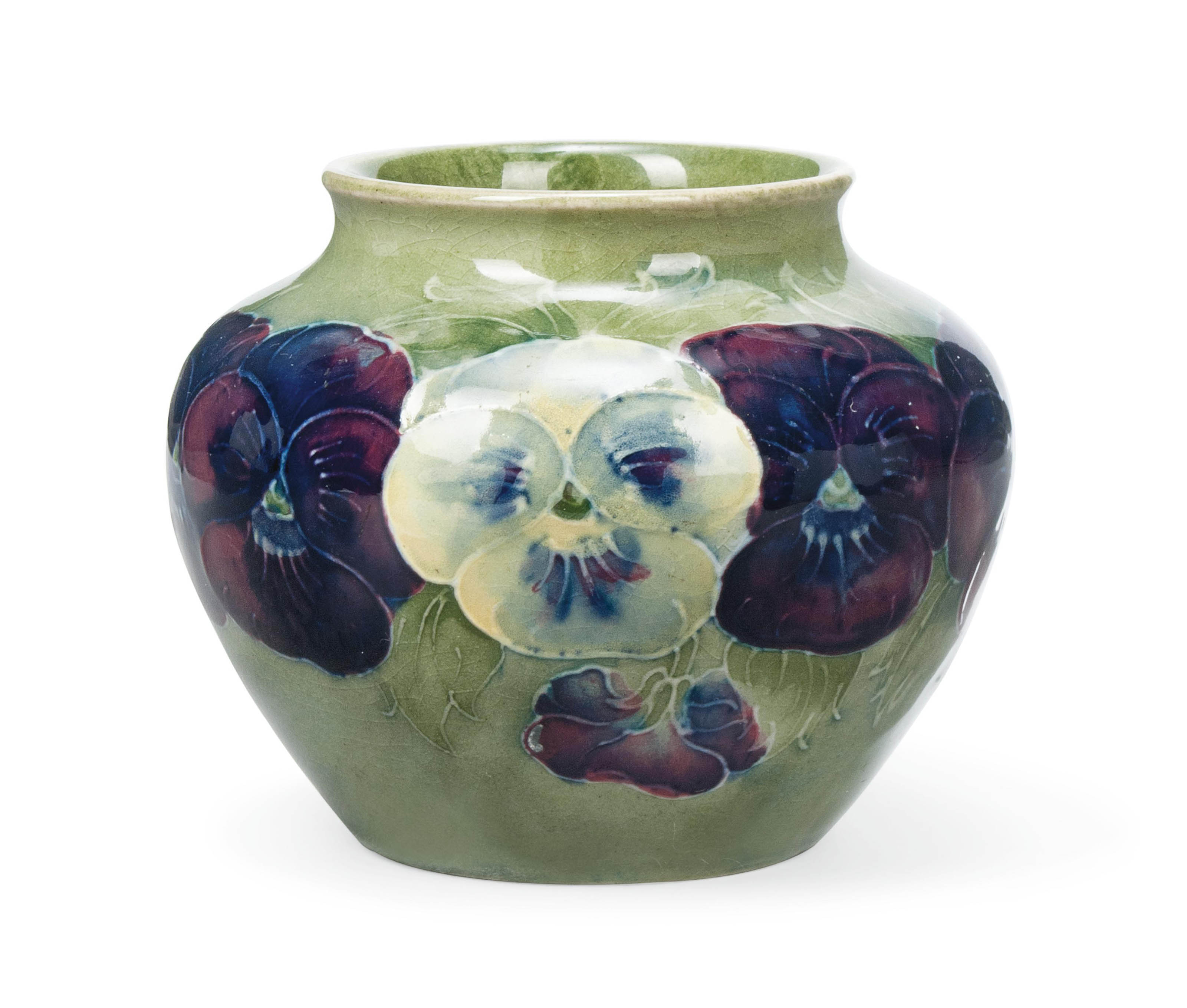A WILLIAM MOORCROFT 'PANSY' PATTERN CERAMIC VASE , CIRCA 1915 Christie's