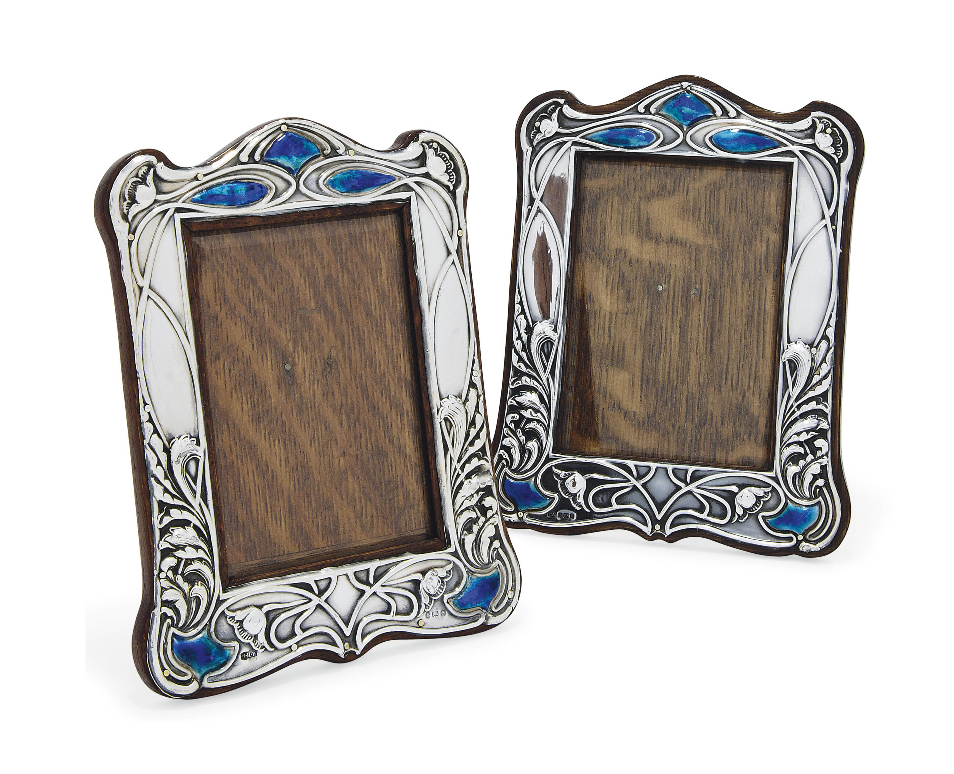 A MATCHED PAIR OF EDWARDIAN ART NOUVEAU SILVER AND ENAMEL PHOTOGRAPH