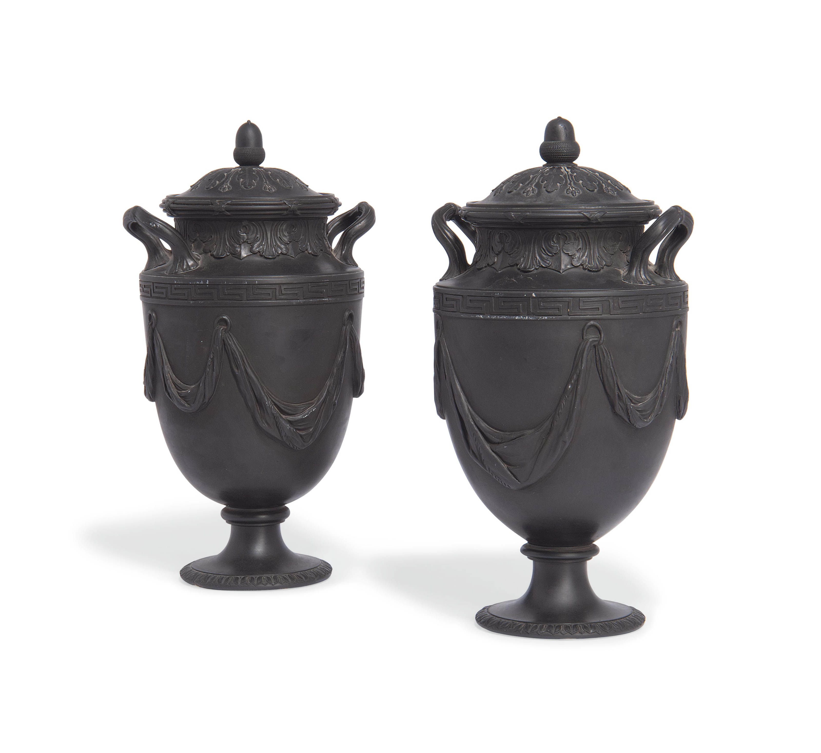 A PAIR OF WEDGWOOD BLACK BASALT TWOHANDLED VASES AND COVERS , 1871