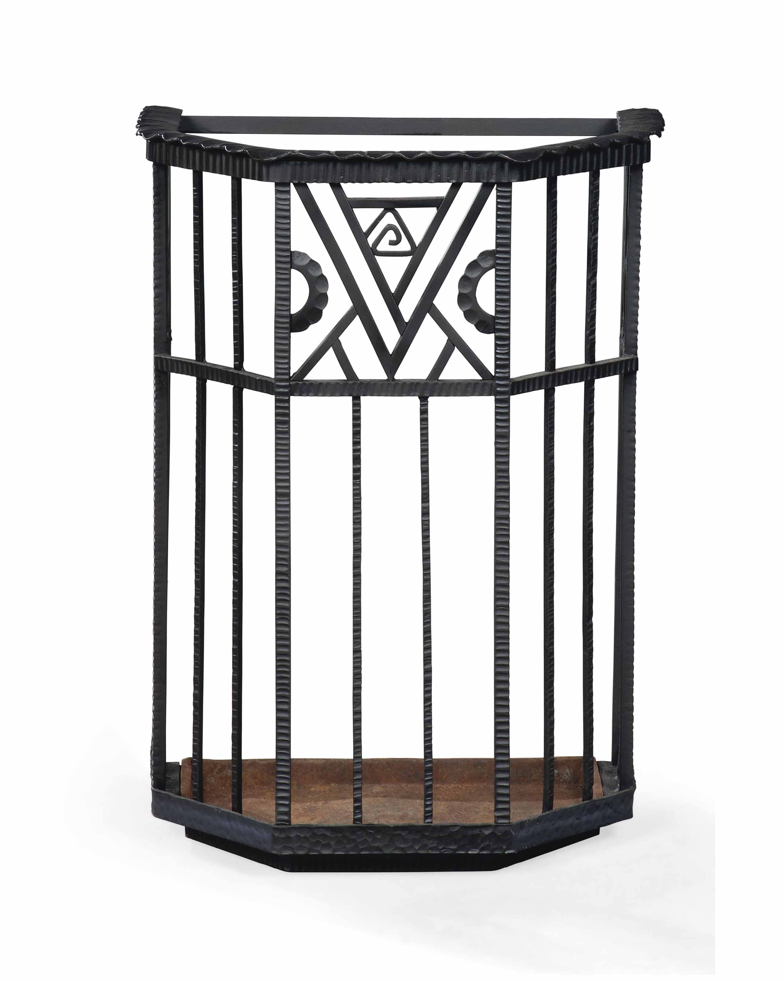 AN ART DECO WROUGHTIRON UMBRELLA STAND BY LE FER , CIRCA 1930